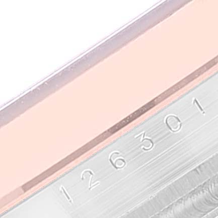 This image shows a close-up of the case side and serial number of a Rolex Datejust 41 126301 Men's Steel and Gold (two tone) Pink Dial 126301 Men's Steel and Gold (two tone) Pink Dial model.