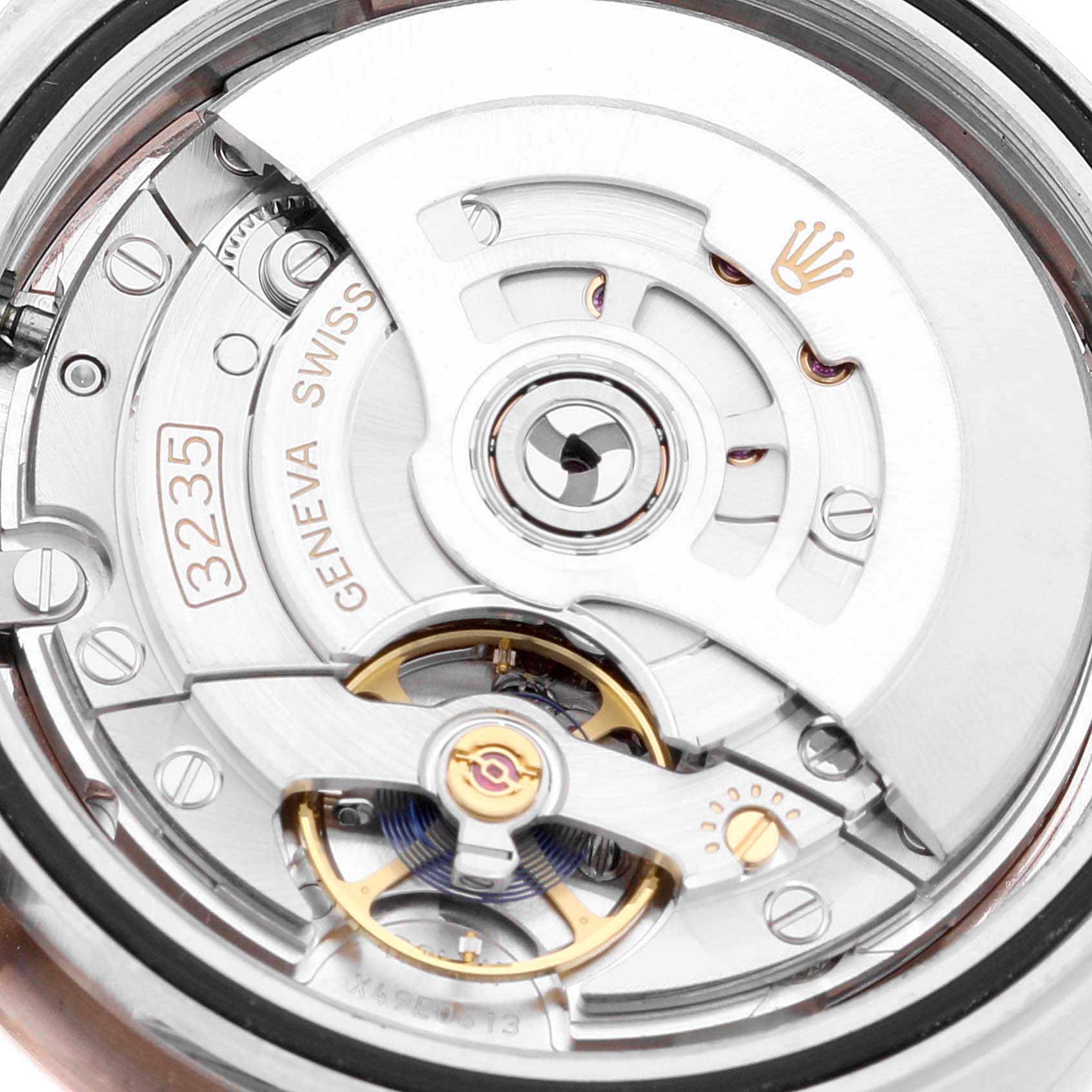 The image shows the movement mechanism of a Rolex Datejust 41 126301 Men's Steel and Gold (two tone) Pink Dial 126301 Men's Steel and Gold (two tone) Pink Dial model at a close-up angle.
