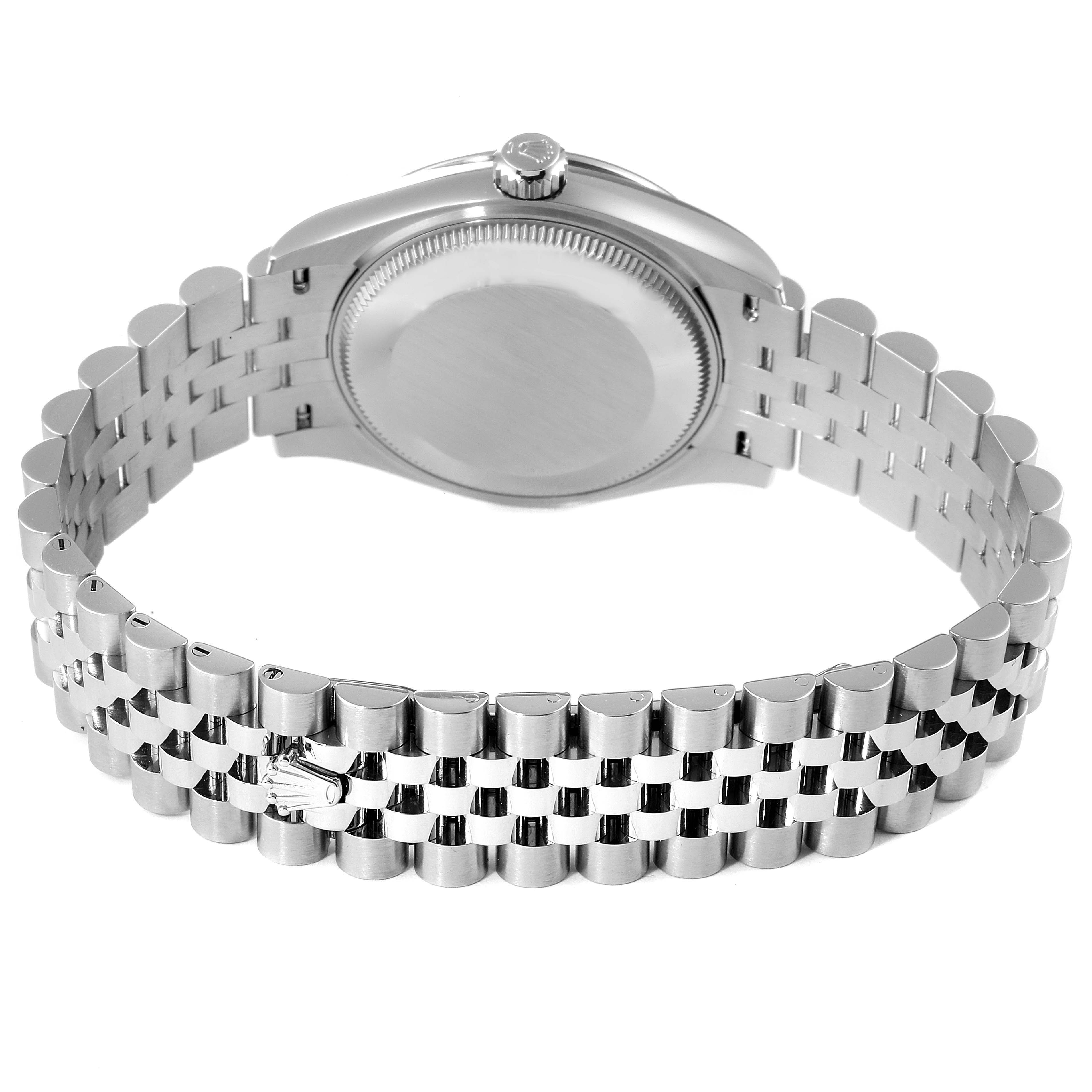 The image shows the back view and bracelet of a Mid-Size Rolex watch with a focus on the clasp and crown.