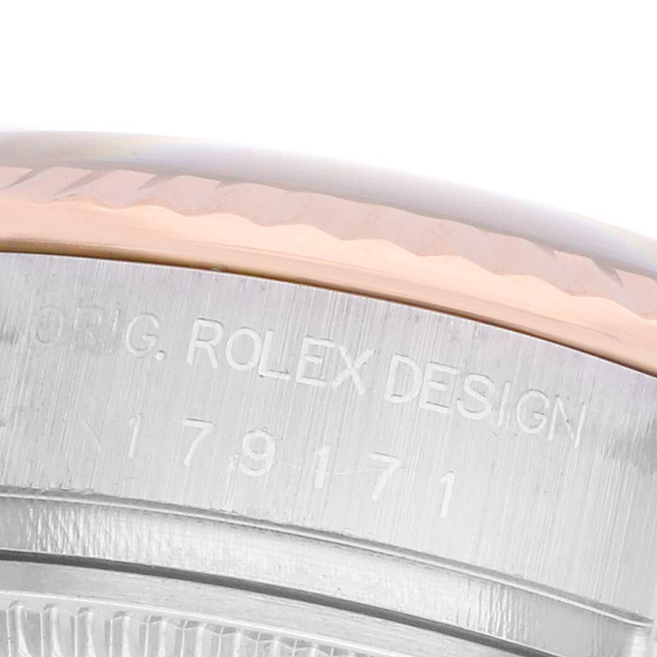 The image shows a close-up of the case side engraving on a Rolex Datejust 179171 Women
s Steel and Gold (two tone) Black Dial, displaying the "ORIG. ROLEX DESIGN" text and numbers.