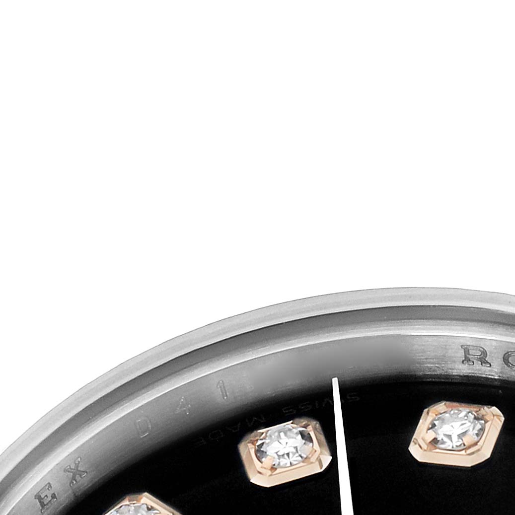 The image shows a close-up of the dial and bezel of a Rolex Datejust 179171 Women
s Steel and Gold (two tone) Black Dial, highlighting diamond hour markers.