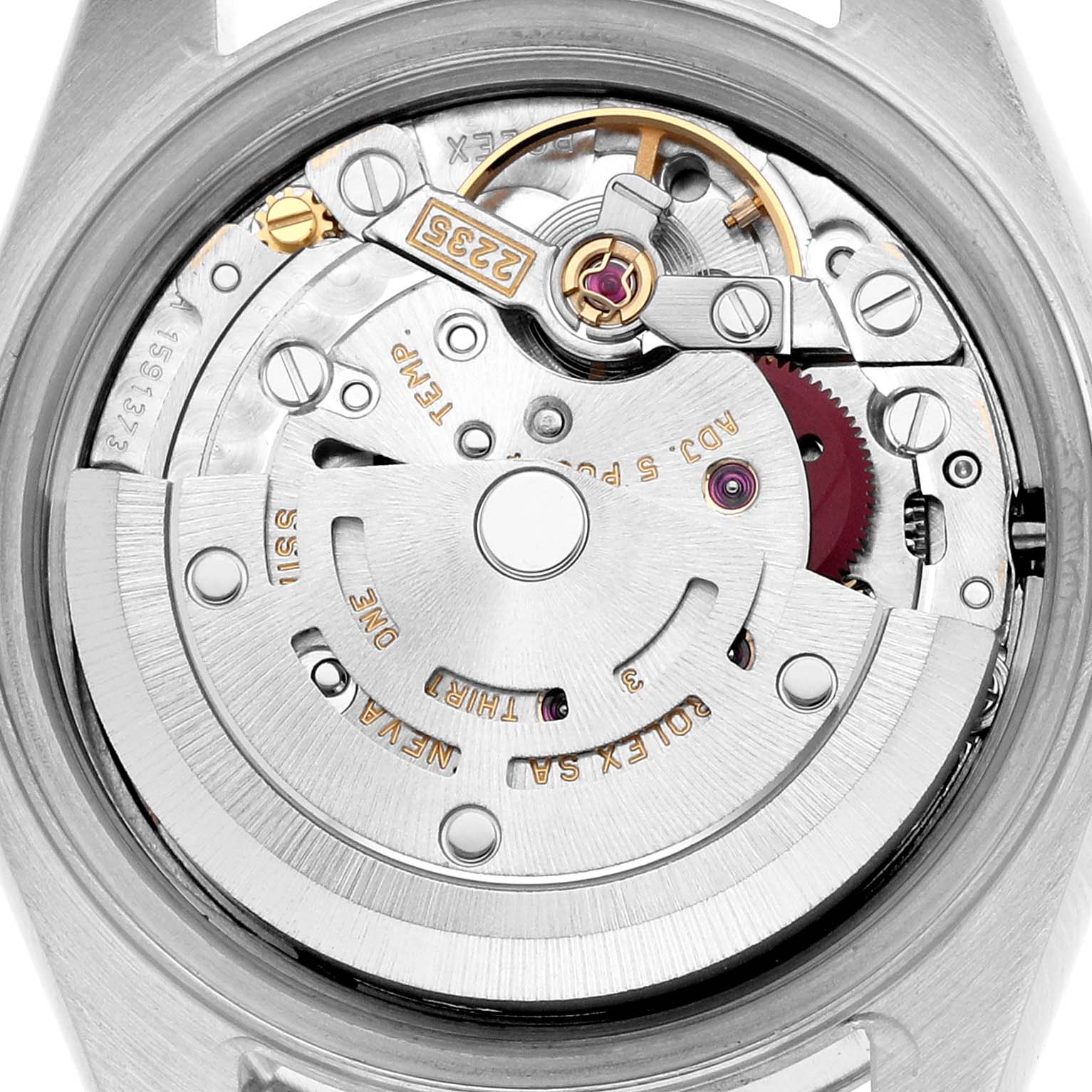 The image shows a close-up of the Rolex Datejust 79174 Men
s Stainless Steel Pink Dial
s movement mechanism from the back.