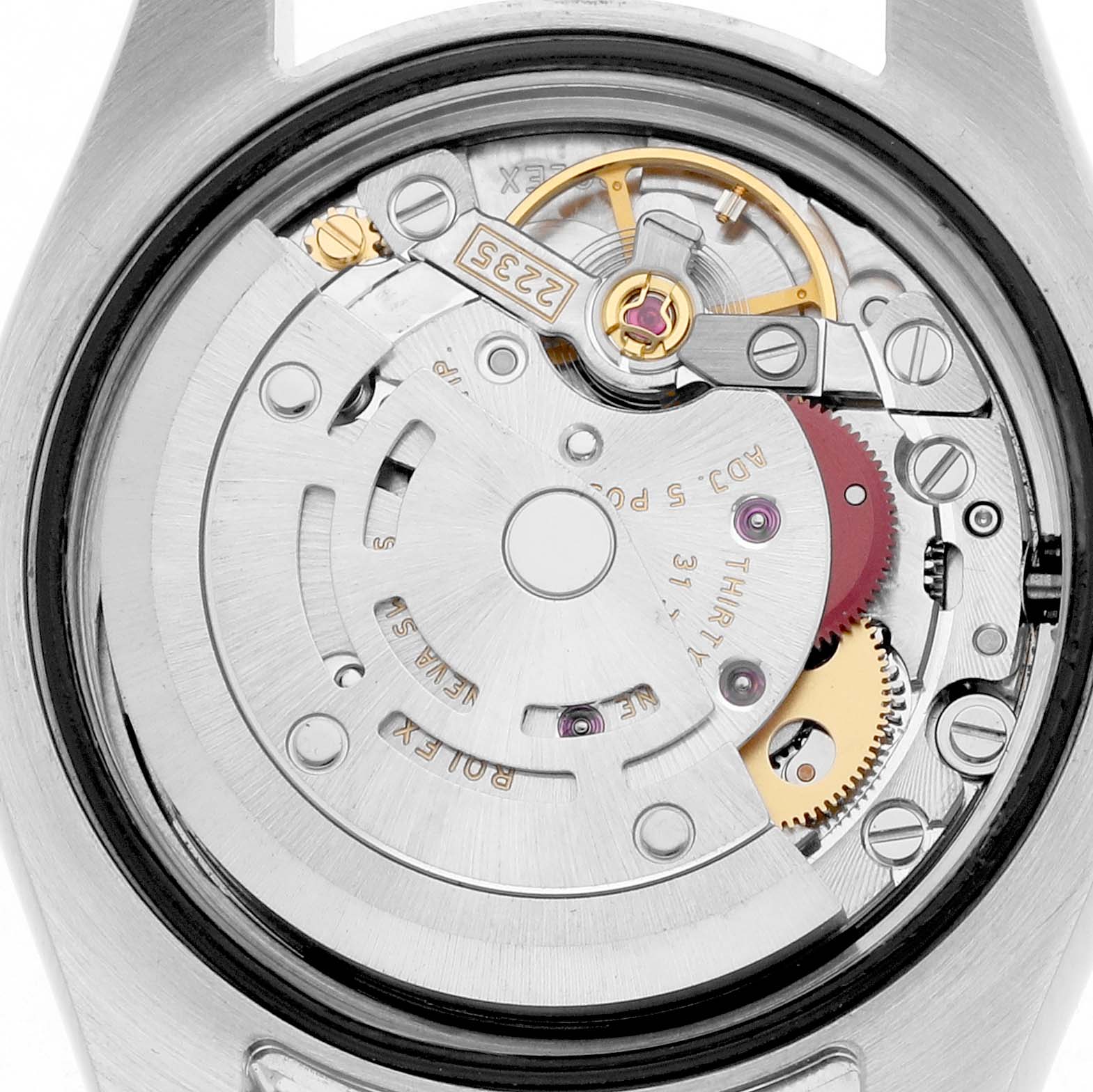 The image shows the movement of a Rolex Datejust 179174 Women
s Stainless Steel Silver Dial watch from the back, highlighting gears and mechanical components.