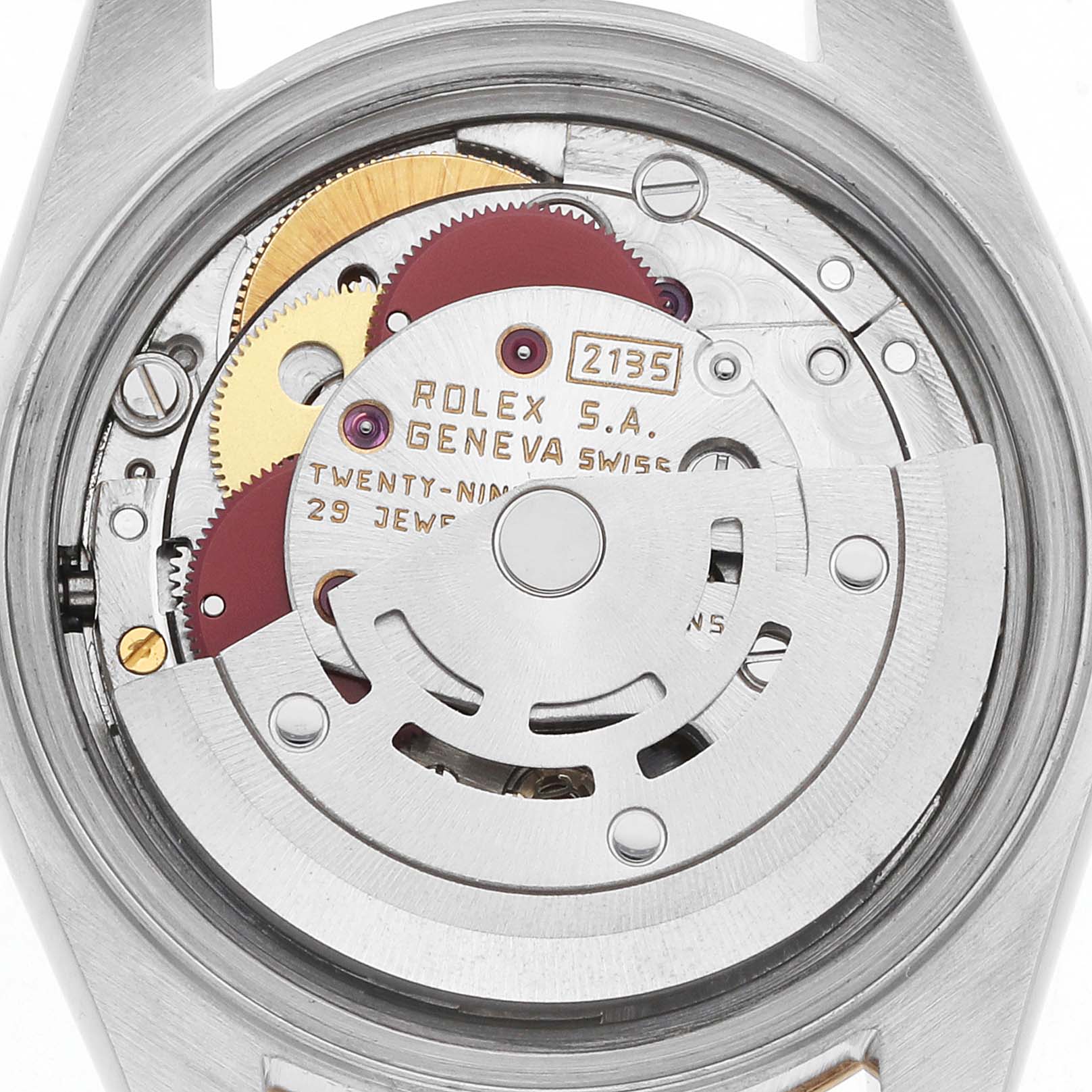 The image shows the internal movement of a Rolex Datejust 69173 Women
s Steel and Gold (two tone) Silver Dial watch from a top-down angle, highlighting gears and mechanisms.