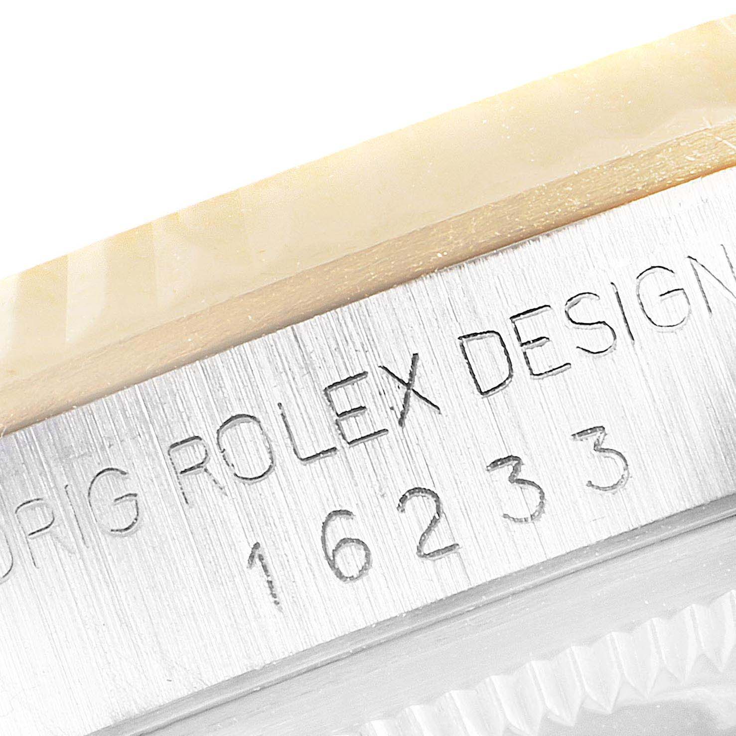 This close-up image shows the case side and model number engraving (16233) on a Rolex Datejust 16233 Men's Steel and Gold (two tone) Blue Dial 16233 Men's Steel and Gold (two tone) Blue Dial watch.