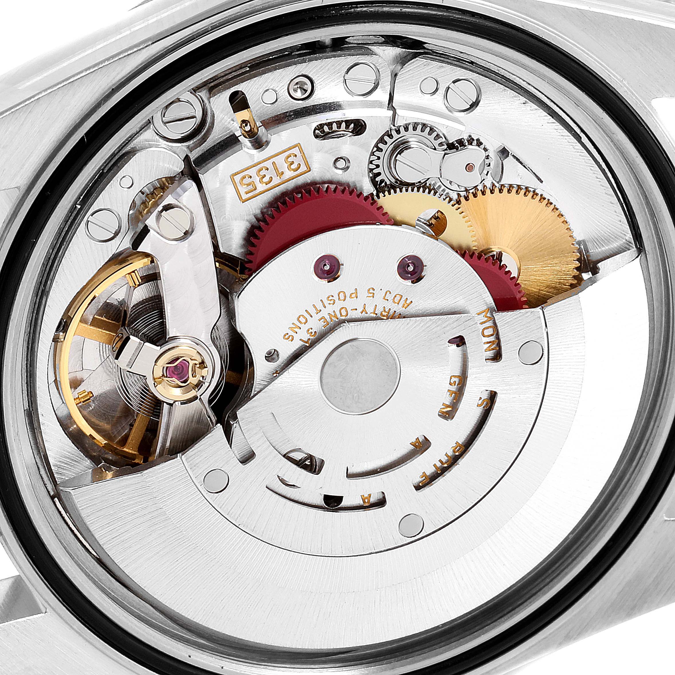 This image shows the intricate internal mechanism of a Rolex Datejust 16233 Men's Steel and Gold (two tone) Blue Dial 16233 Men's Steel and Gold (two tone) Blue Dial watch from an opened caseback angle.