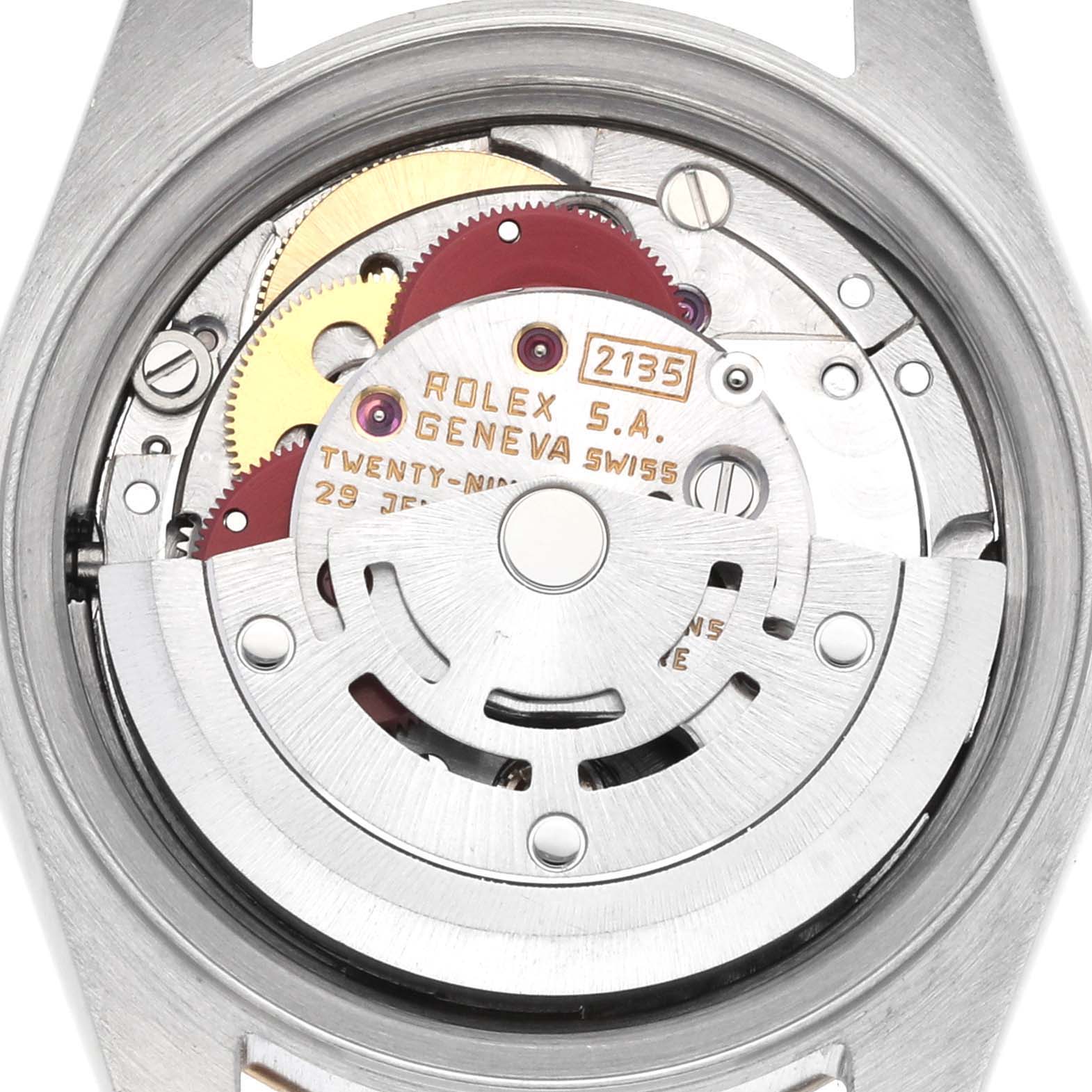 The image shows the movement of the Rolex Datejust 69173 Women
s Steel and Gold (two tone) Champagne Dial watch from a top-down angle, highlighting gears and rotors.