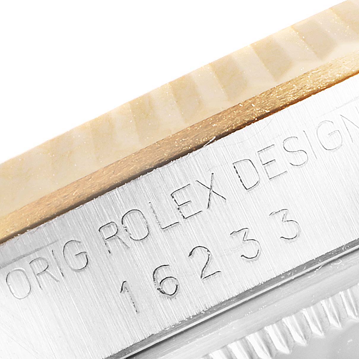 The image shows a close-up of the side of a Rolex Datejust 16233 Men's Steel and Gold (two tone) Beige Dial 16233 Men's Steel and Gold (two tone) Beige Dial watch, highlighting the engraved model number "16233" and part of the bezel.