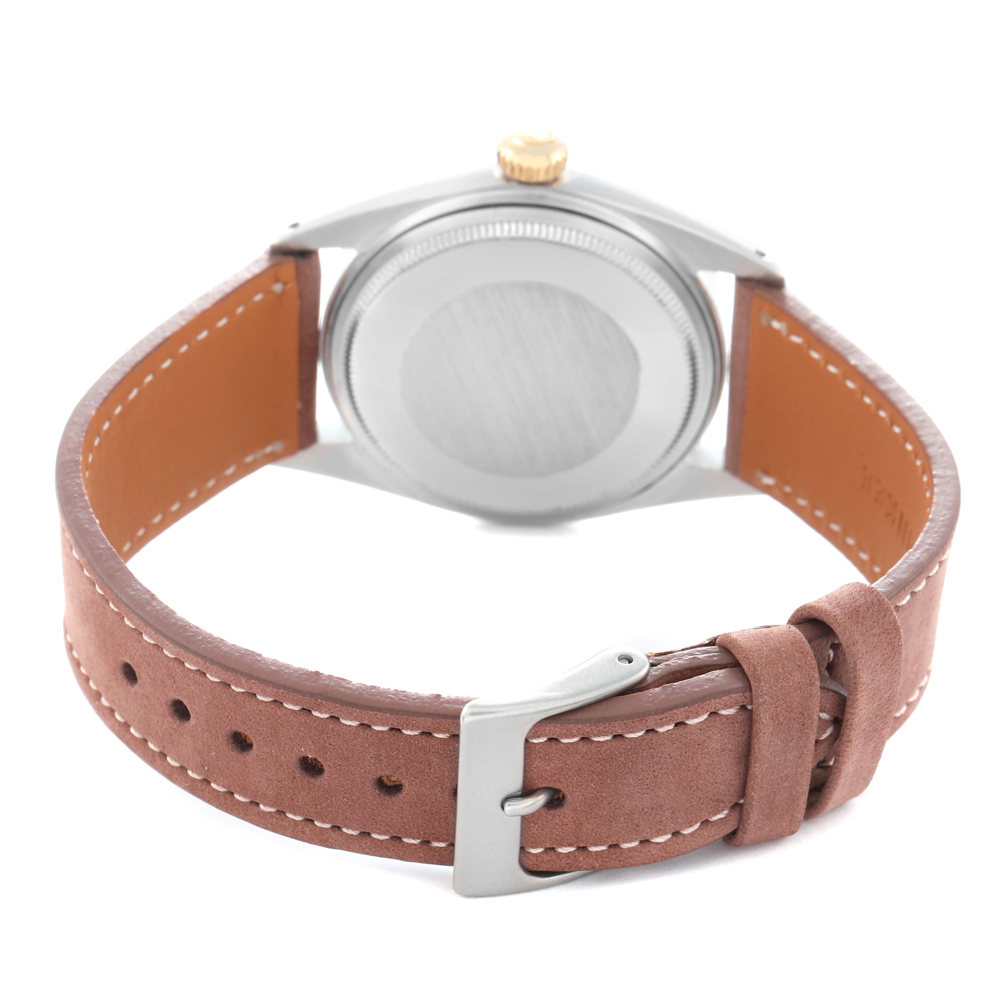 The image shows the back view of the Rolex Vintage Collection 16013 Men
s Steel and Gold (two tone) Champagne Dial watch, highlighting the case back, brown leather strap, and buckle.
