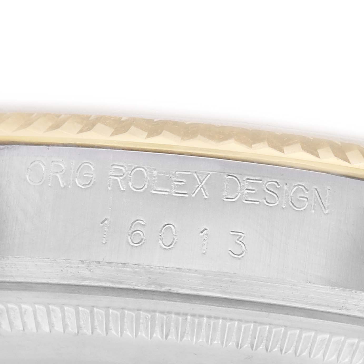 The image shows the side of a Rolex Vintage Collection 16013 Men
s Steel and Gold (two tone) Champagne Dial watch case, featuring model number "16013" and marked "ORIG ROLEX DESIGN."