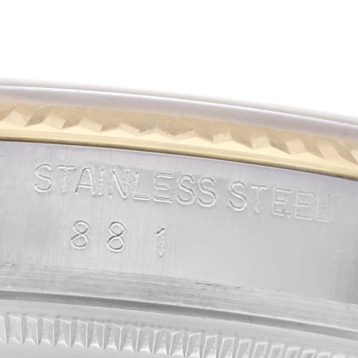 This image shows a close-up of the engraved stainless steel edge of the Rolex Vintage Collection 16013 Men
s Steel and Gold (two tone) Champagne Dial watch.