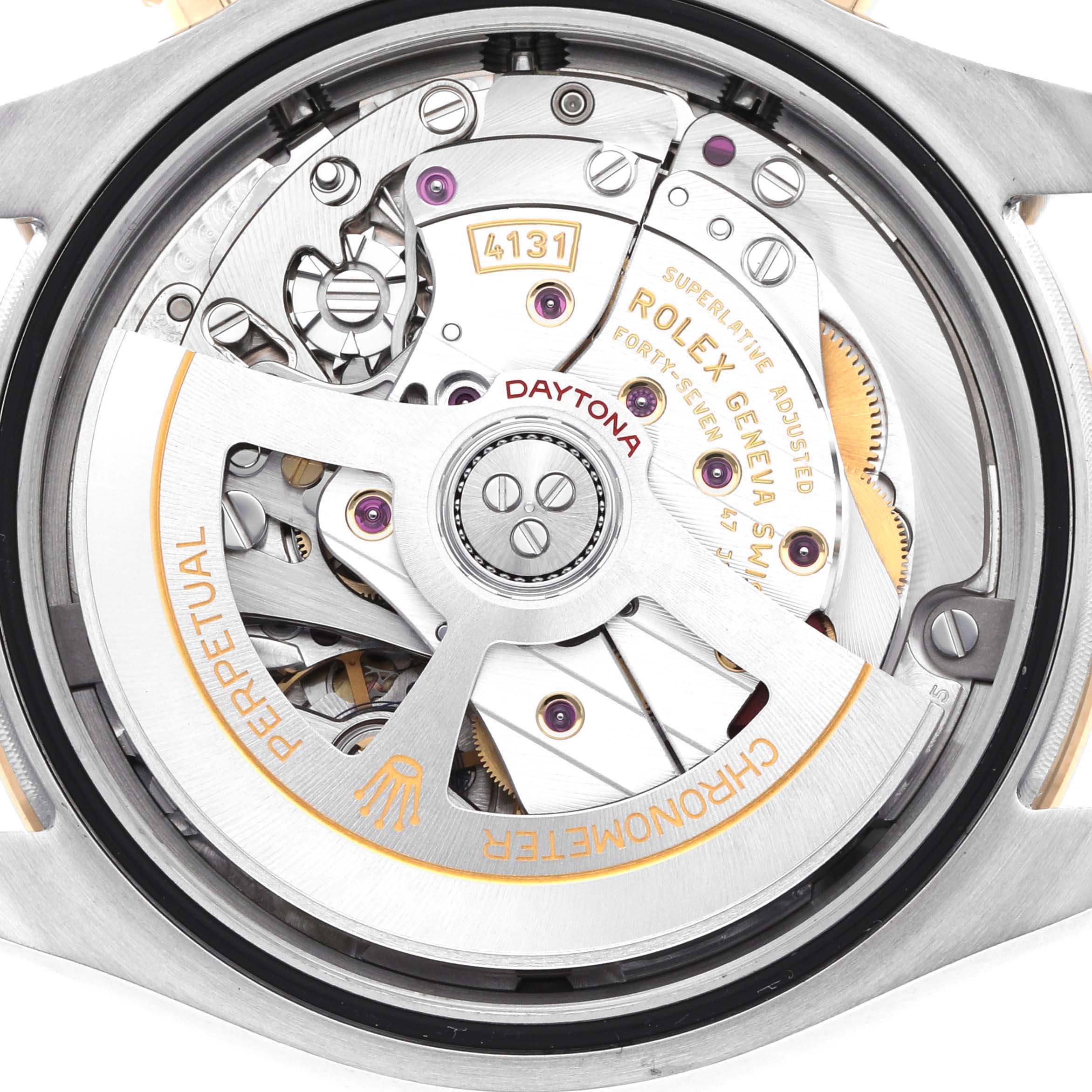 The image shows the back view of a Rolex Daytona 126503 Men
s Steel and Gold (two tone) Champagne Dial, featuring its intricate mechanical movement and rotor.