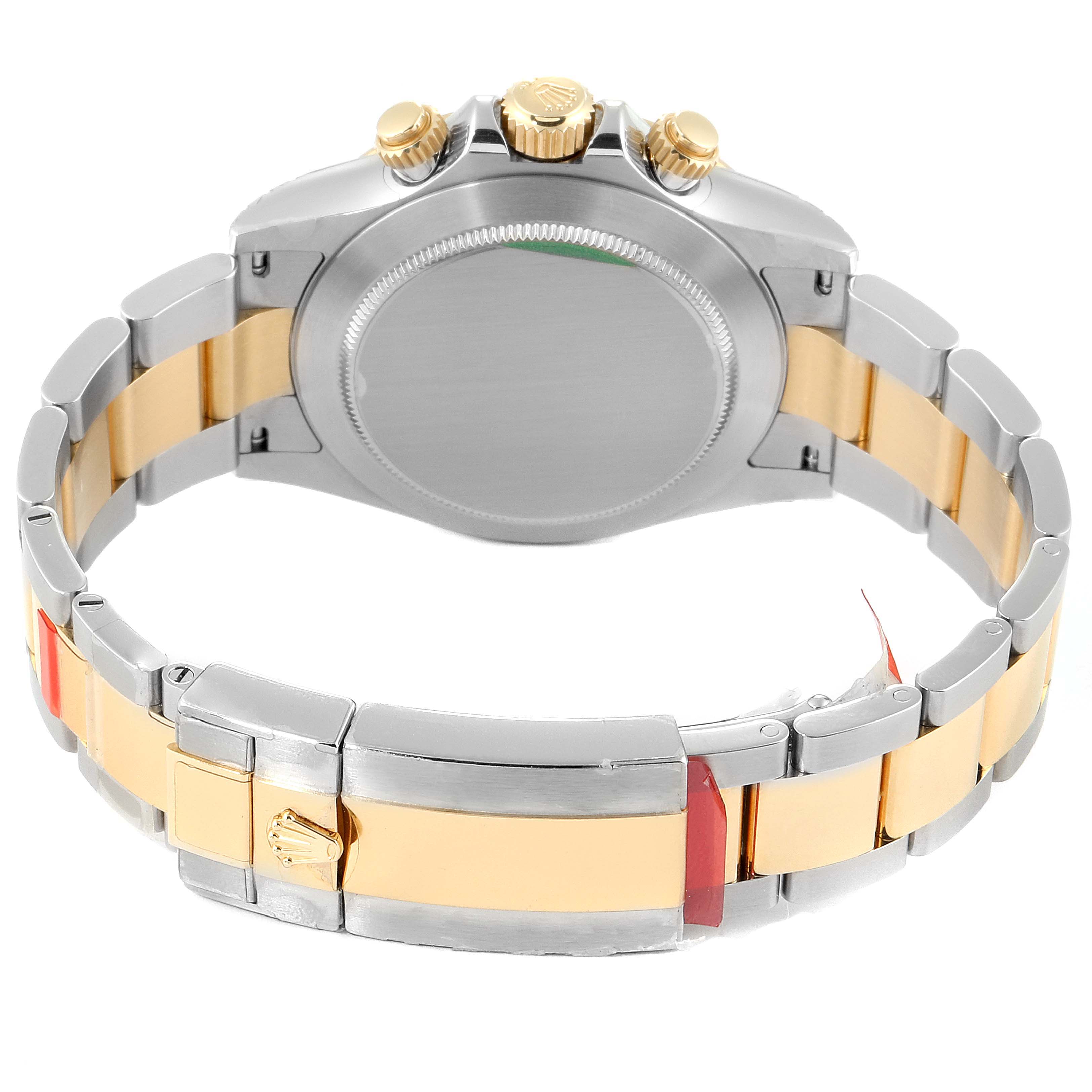 This image shows the back and bracelet of a Rolex Daytona 116523 Men's Steel and Gold (two tone) Mother of Pearl Dial 116523 Men's Steel and Gold (two tone) Mother of Pearl Dial watch, highlighting its two-tone links and clasp.