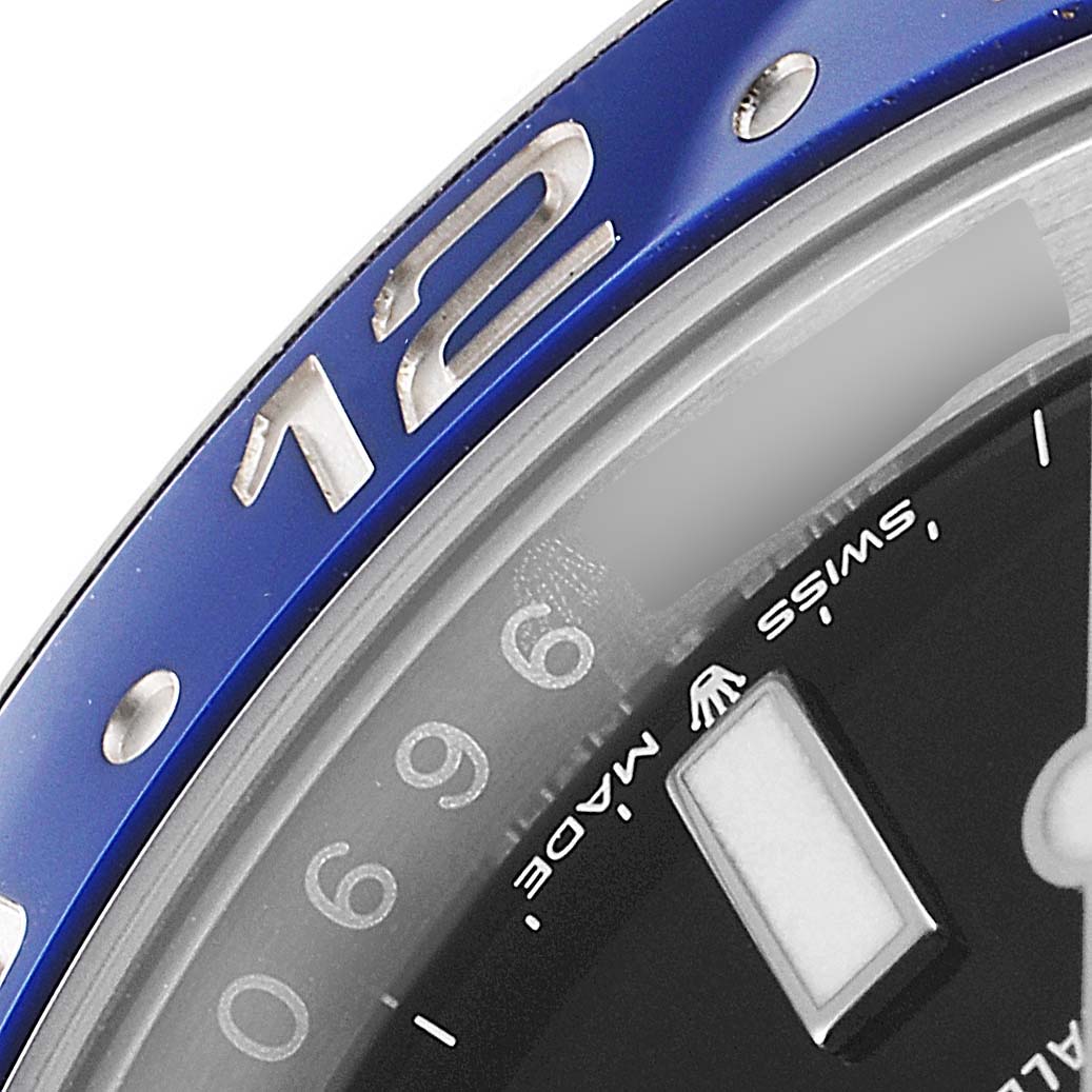 This close-up shot of the Rolex GMT-Master 126710 Men
s Stainless Steel Black Dial 126710 Men
s Stainless Steel Black Dial watch shows part of the blue bezel, dial, and "Swiss Made" text.