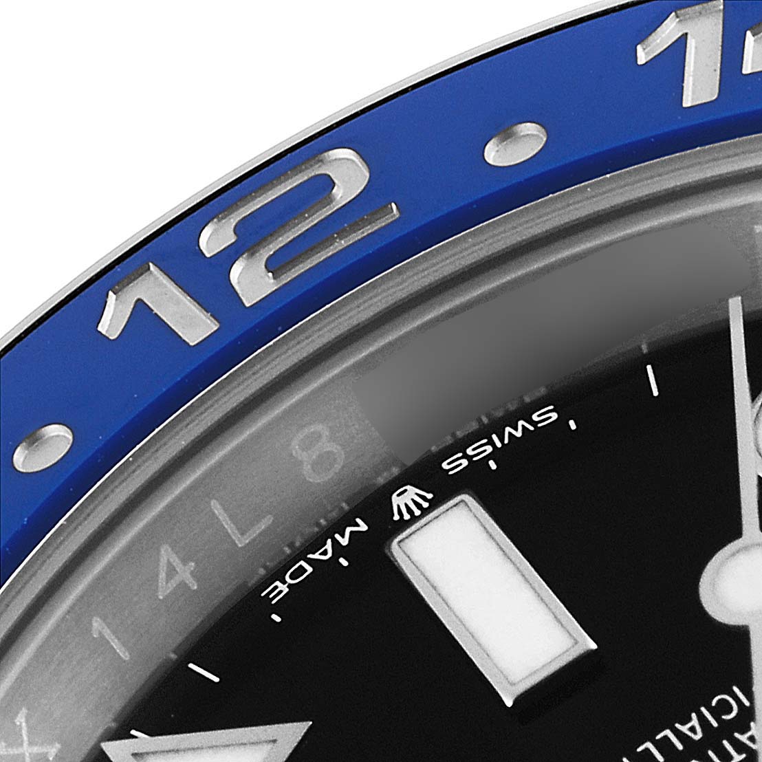 The image shows a close-up of the bezel and part of the dial of the Rolex GMT-Master 126710 Men
s Stainless Steel Black Dial 126710 Men
s Stainless Steel Black Dial watch, highlighting the blue section and the number "12."