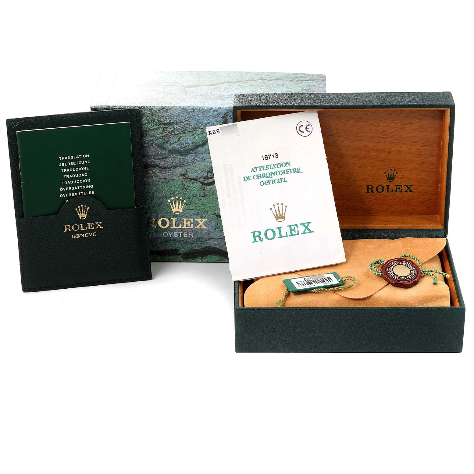 The image shows the box, papers, and accessories for a Rolex GMT-Master 16713 Men's Steel and Gold (two tone) Black Dial 16713 Men's Steel and Gold (two tone) Black Dial watch, including the certificate and warranty card holder.