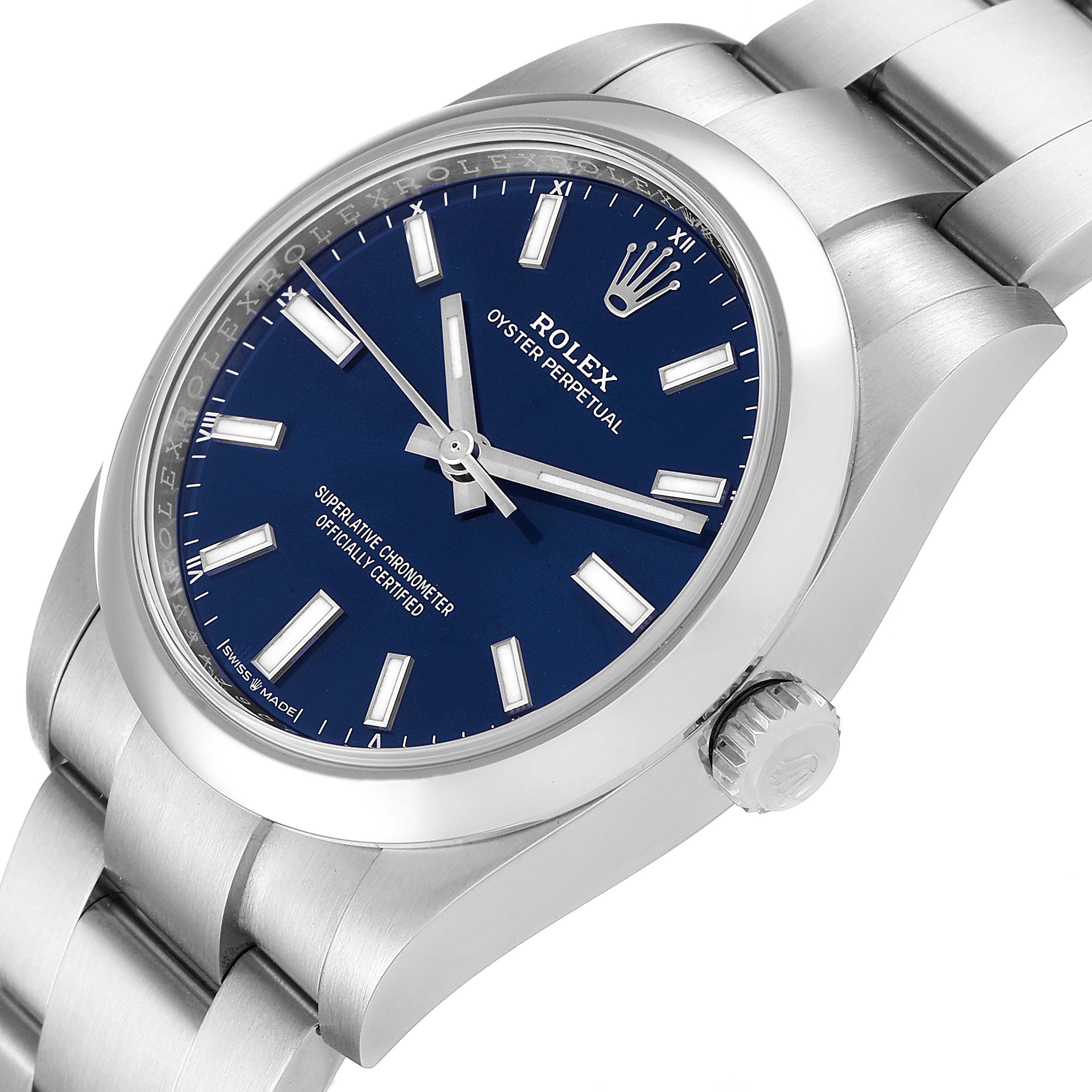 The image shows a Rolex Oyster Perpetual 124200 Men's Stainless Steel Blue Dial 124200 Men's Stainless Steel Blue Dial watch at a slight side angle, highlighting the dial, crown, and part of the bracelet.