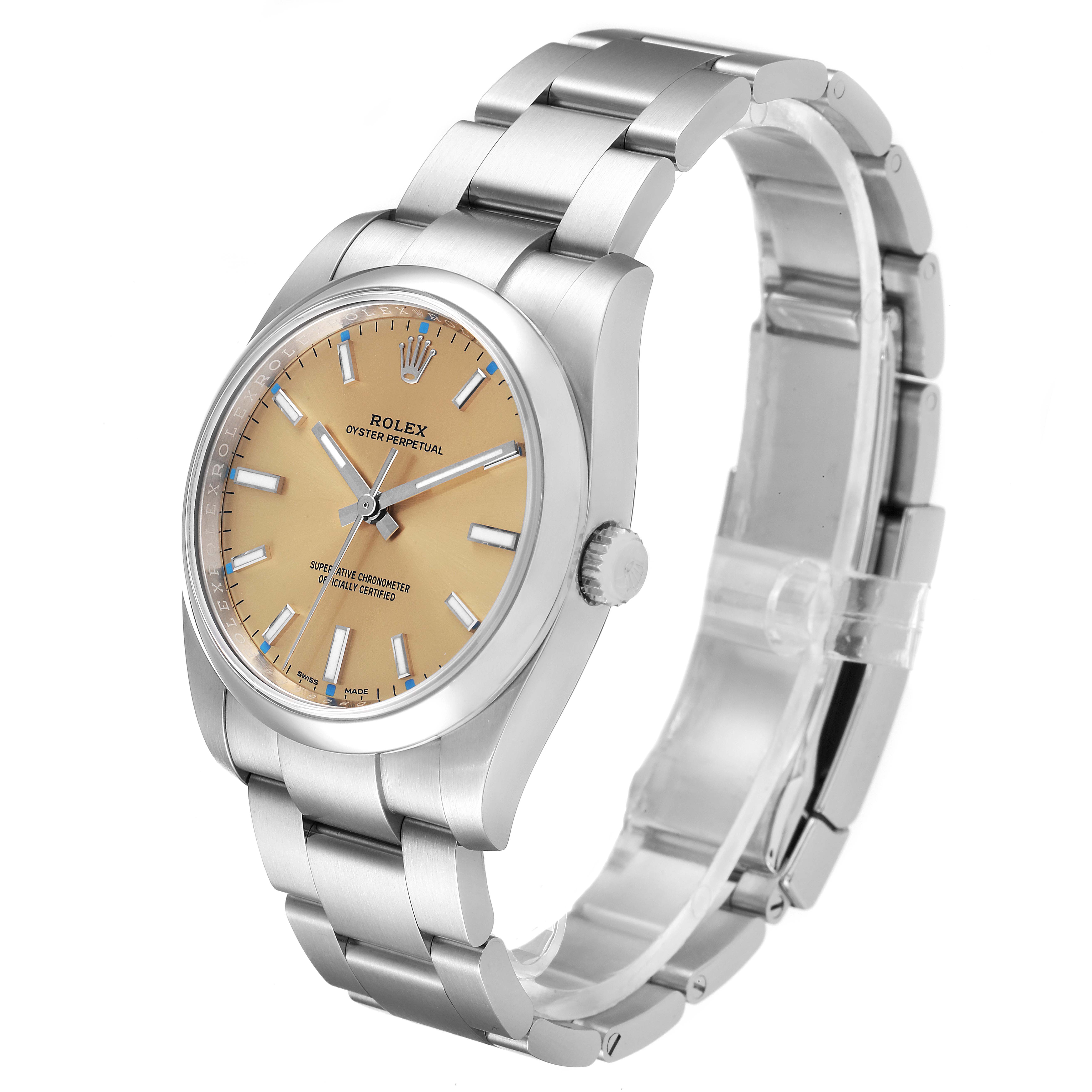 The image shows a Rolex Oyster Perpetual 114200 Men's Stainless Steel Champagne Dial 114200 Men's Stainless Steel Champagne Dial watch from a side angle, highlighting the face, bracelet, and crown.