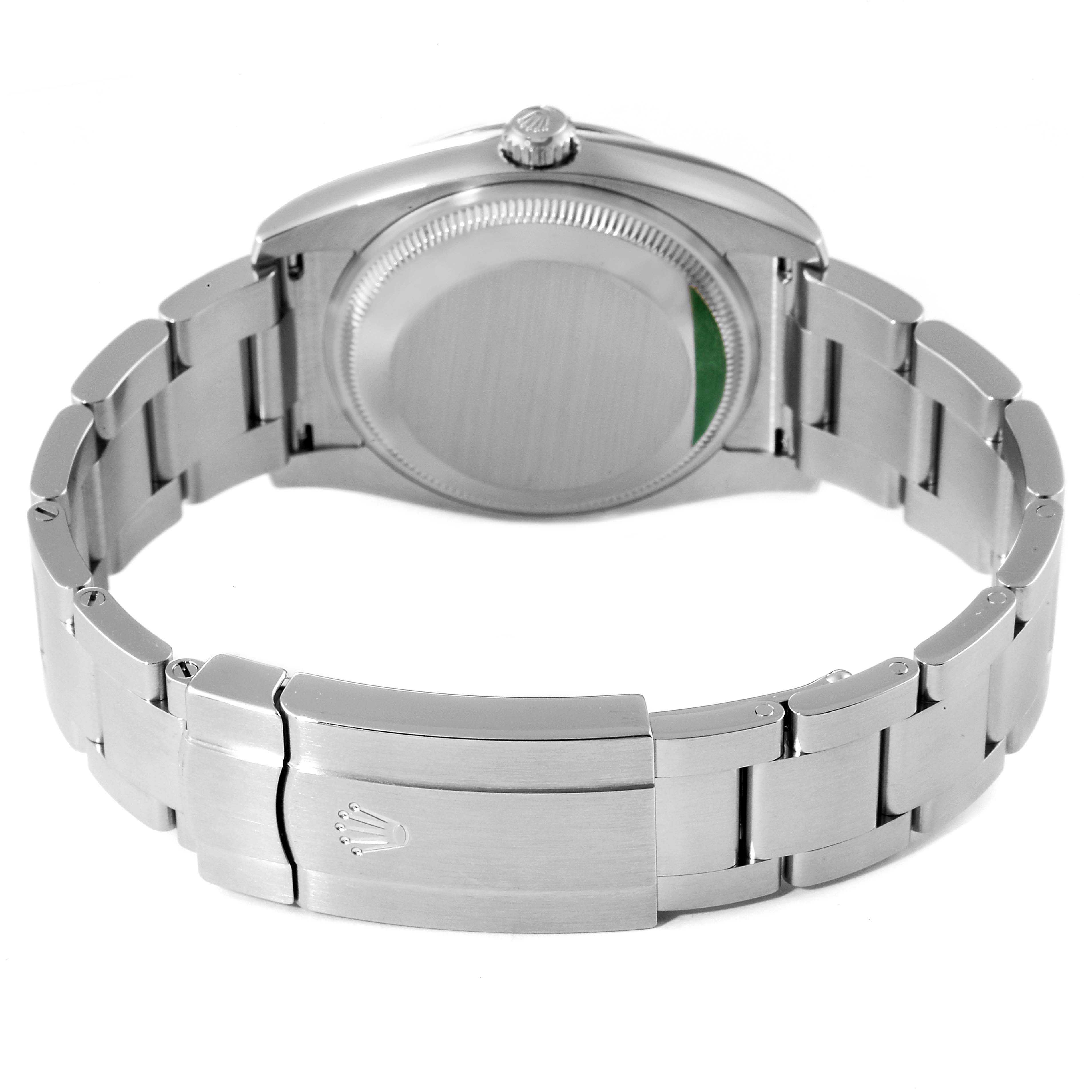 The image shows the back and bracelet of a Rolex Oyster Perpetual 114200 Men's Stainless Steel Champagne Dial 114200 Men's Stainless Steel Champagne Dial watch, featuring the clasp and case back.