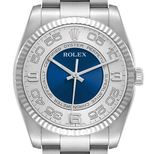 The Rolex Oyster Perpetual 116034 Men's Stainless Steel Blue Dial watch is shown from a front angle, displaying the dial, bezel, and part of the bracelet.
