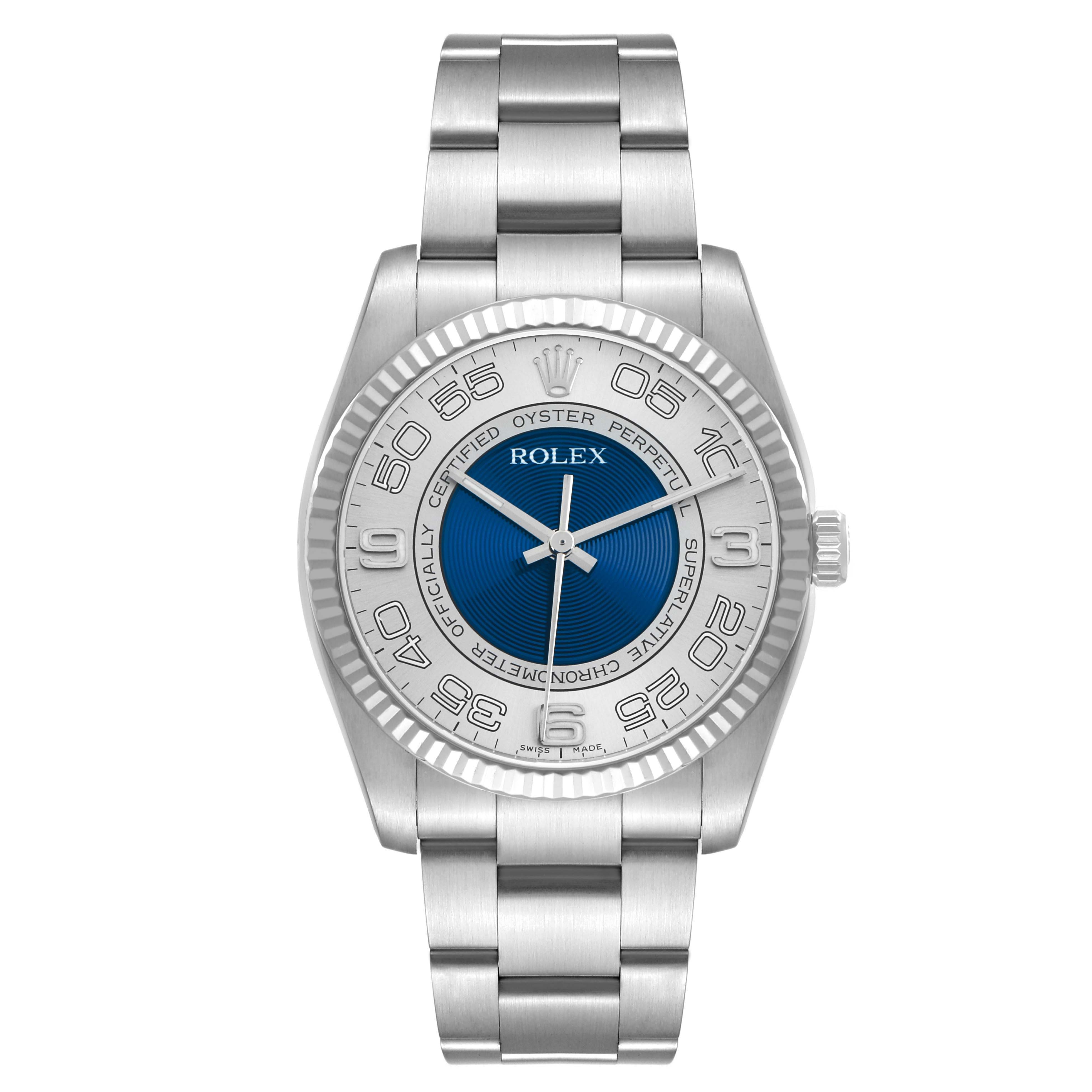 The Rolex Oyster Perpetual 116034 Men
s Stainless Steel Blue Dial watch is shown from a top-down angle, displaying the dial, bezel, and bracelet.