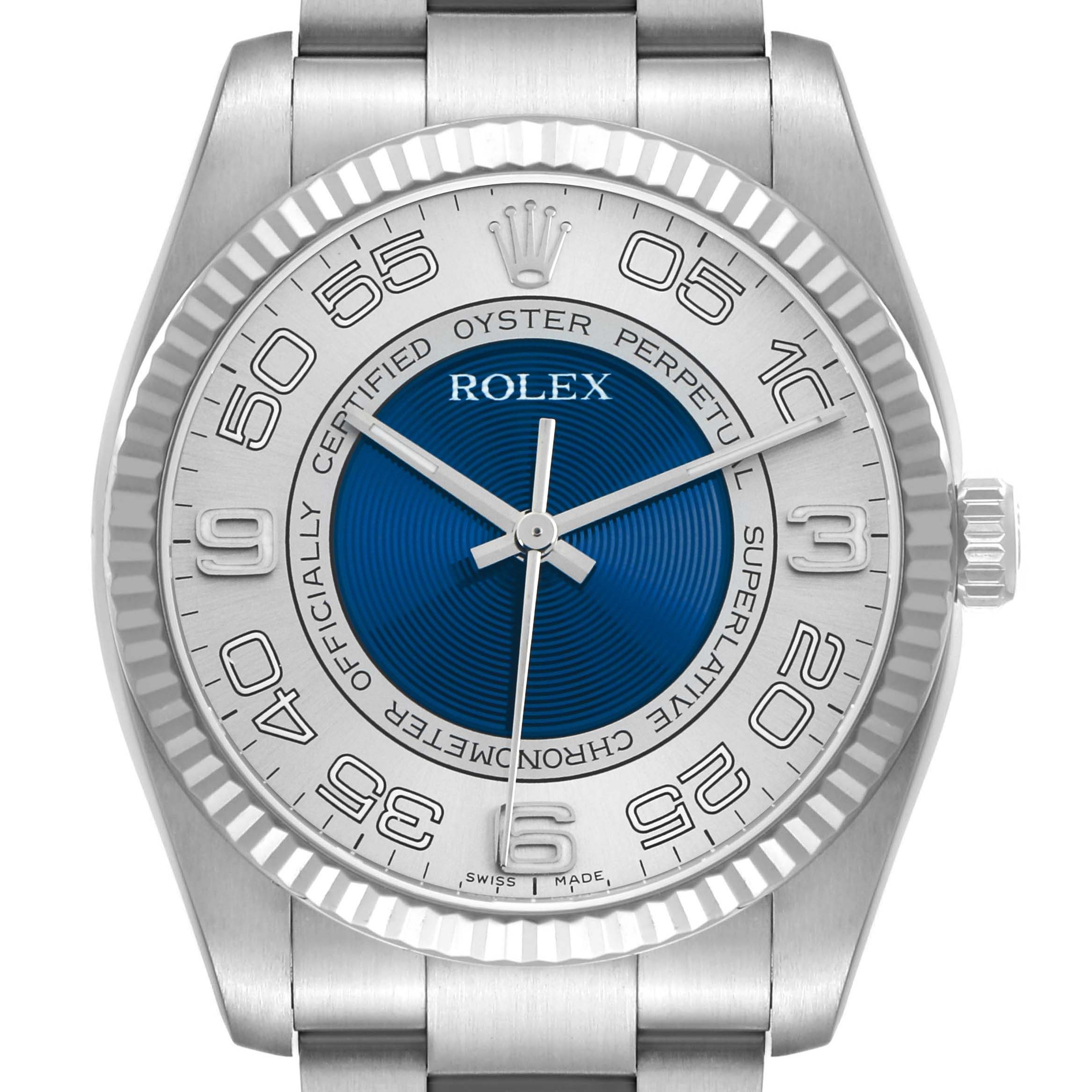 The image shows the Rolex Oyster Perpetual 116034 Men
s Stainless Steel Blue Dial watch from a front angle, highlighting the dial, bezel, and part of the bracelet.