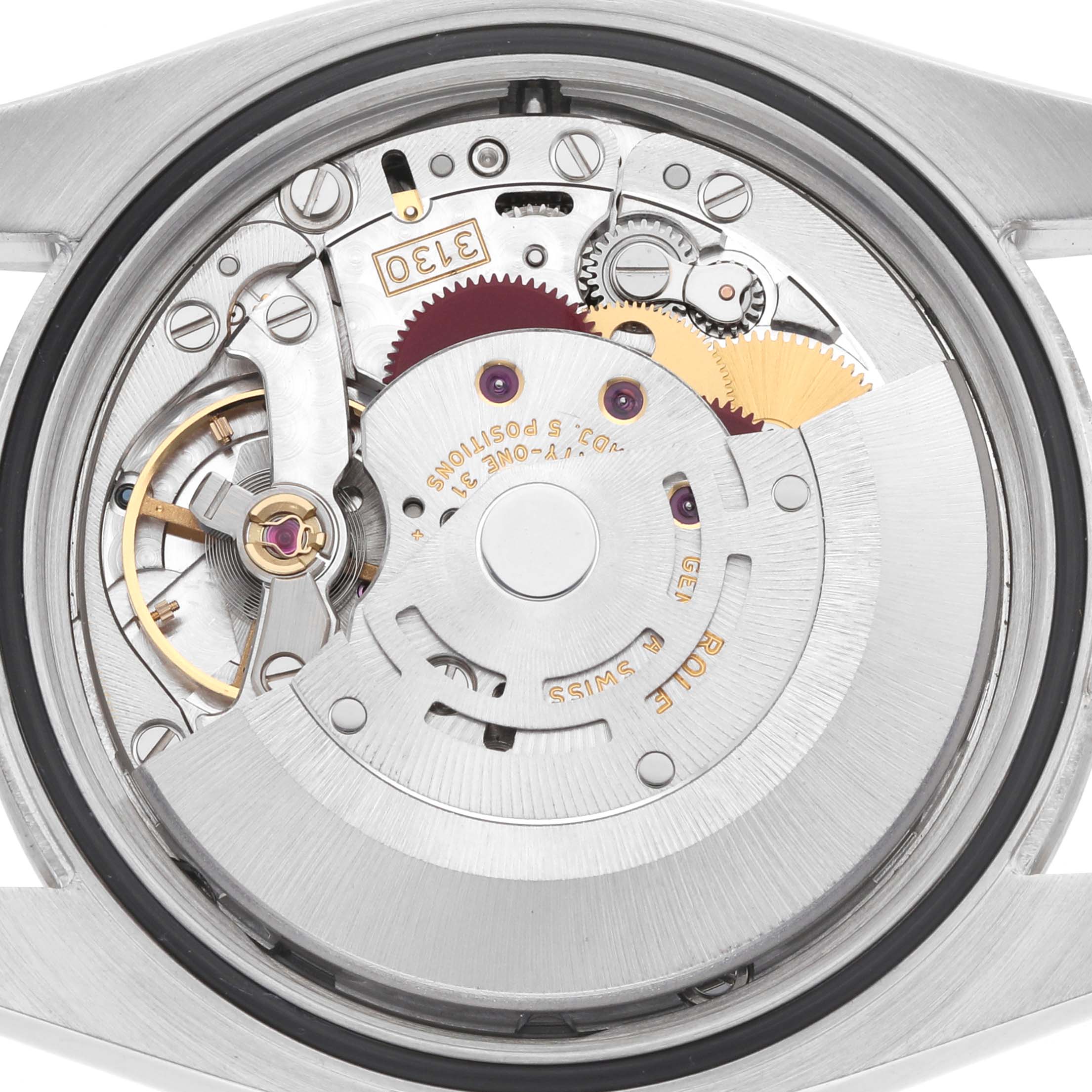 The image shows a close-up of the movement inside a Rolex Oyster Perpetual 116034 Men
s Stainless Steel Blue Dial watch, viewed from the back.