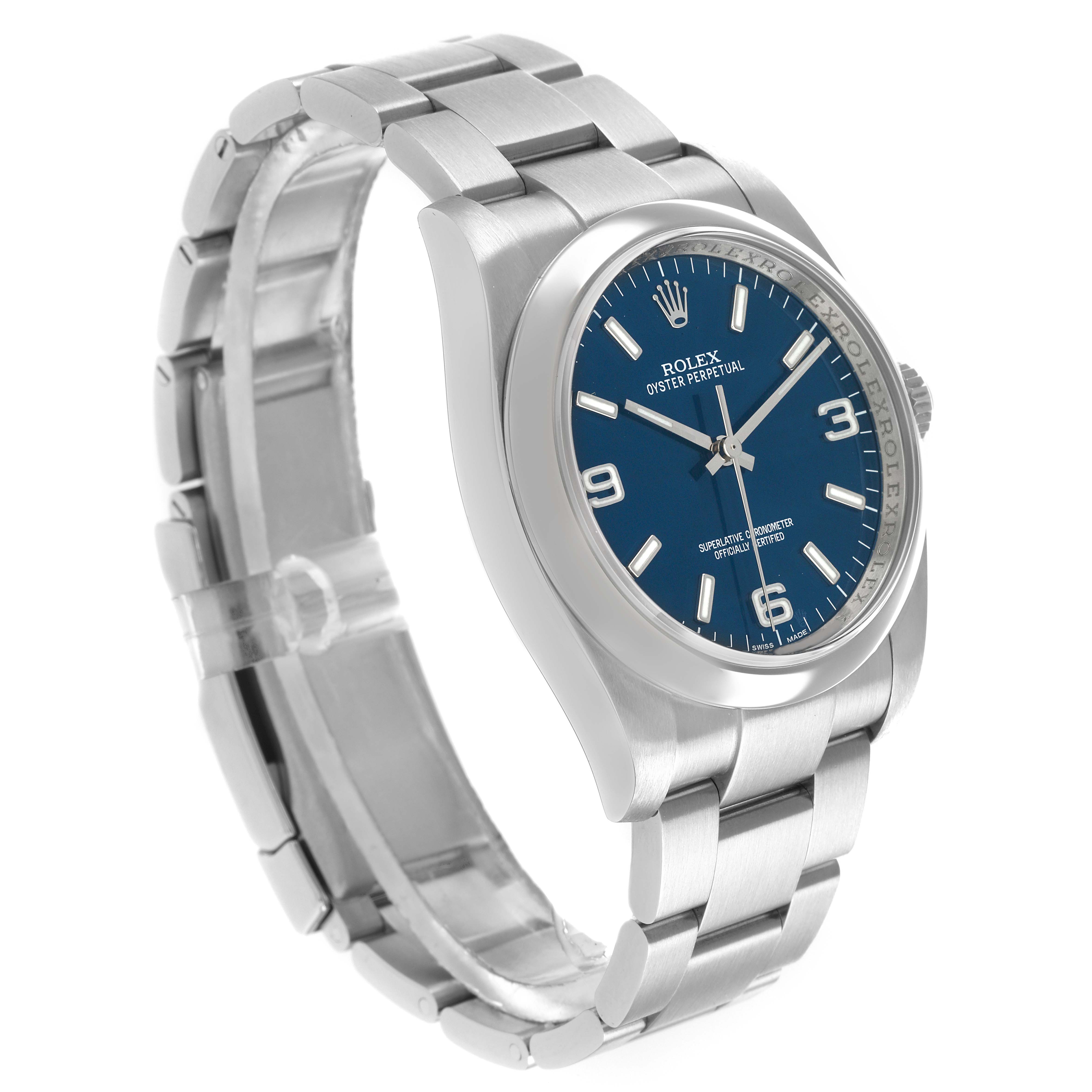 The Rolex Oyster Perpetual 116000 Men's Stainless Steel Blue Dial watch is shown at a three-quarter angle, highlighting the face, bezel, case, and bracelet links.