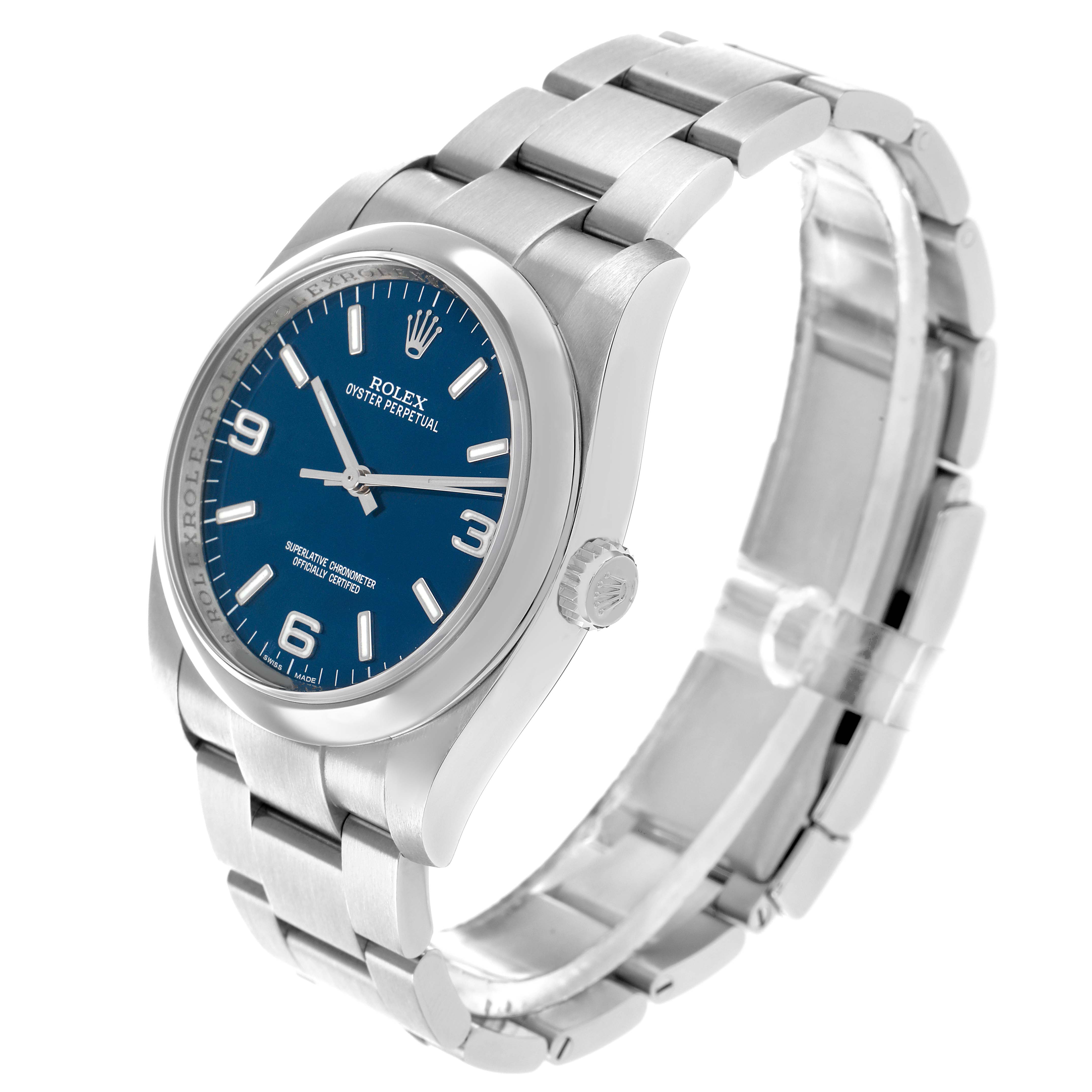 The Rolex Oyster Perpetual 116000 Men's Stainless Steel Blue Dial watch is shown at a three-quarter angle, highlighting the blue dial, bezel, crown, and stainless steel bracelet.