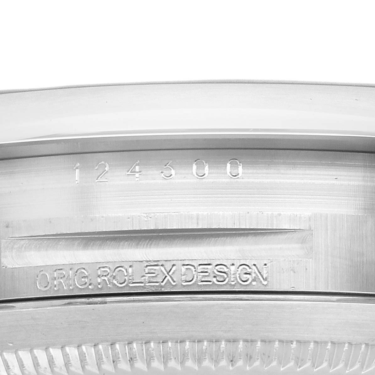 The image shows a close-up of the side edge and serial engraving of the Rolex Oyster Perpetual 124300 Men
s Stainless Steel Silver Dial watch case.