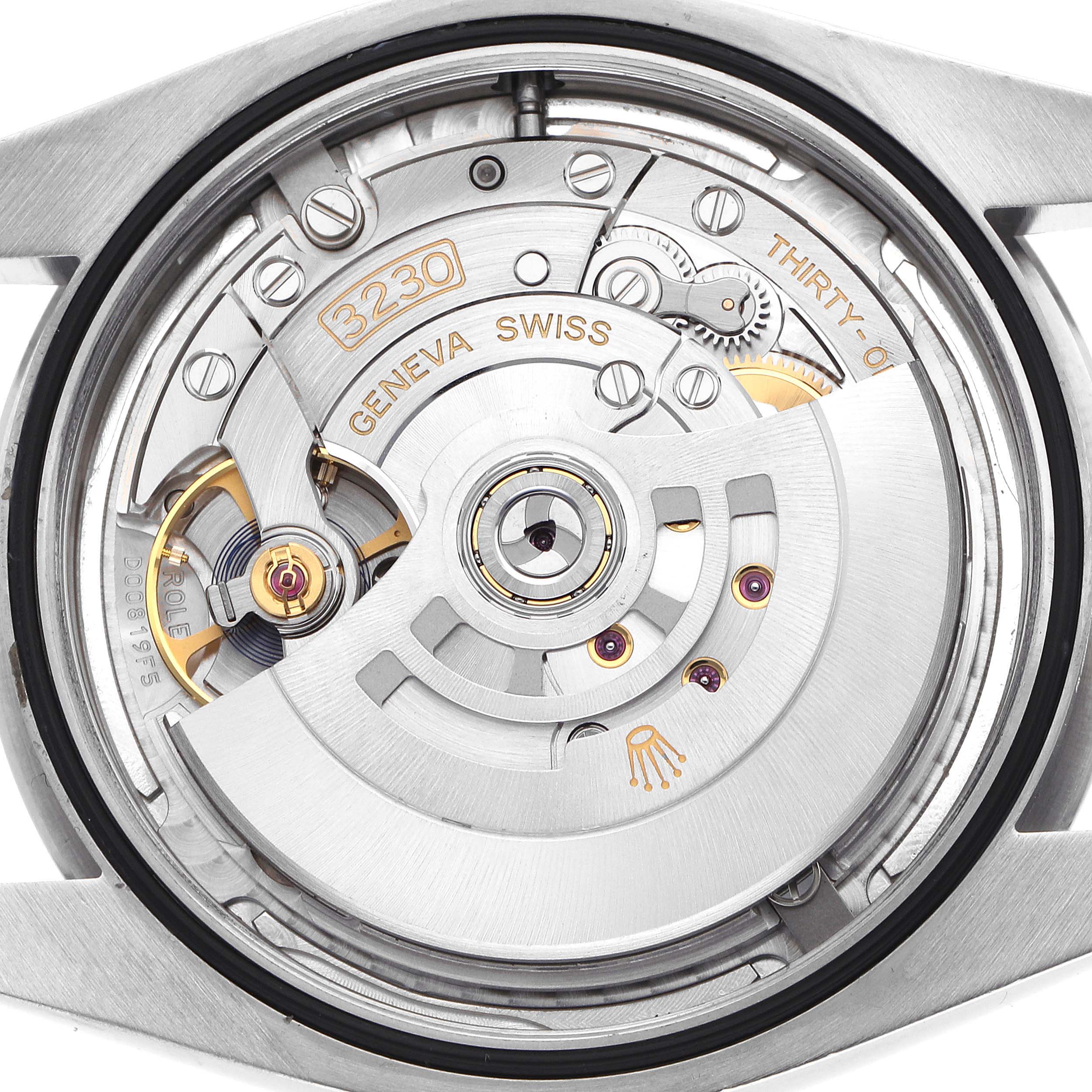 This image shows the case back of a Rolex Oyster Perpetual 124300 Men
s Stainless Steel Silver Dial, revealing its movement and rotor.
