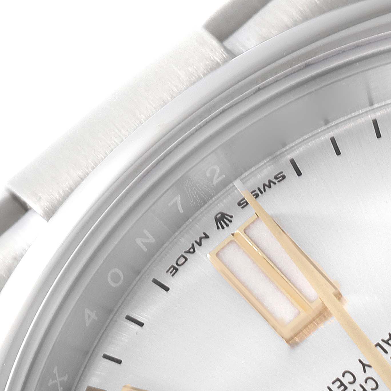 The image shows a close-up of the dial and part of the bezel of a Rolex Oyster Perpetual 124300 Men's Stainless Steel Silver Dial 124300 Men's Stainless Steel Silver Dial watch, focusing on the minute markers and "Swiss Made" text.