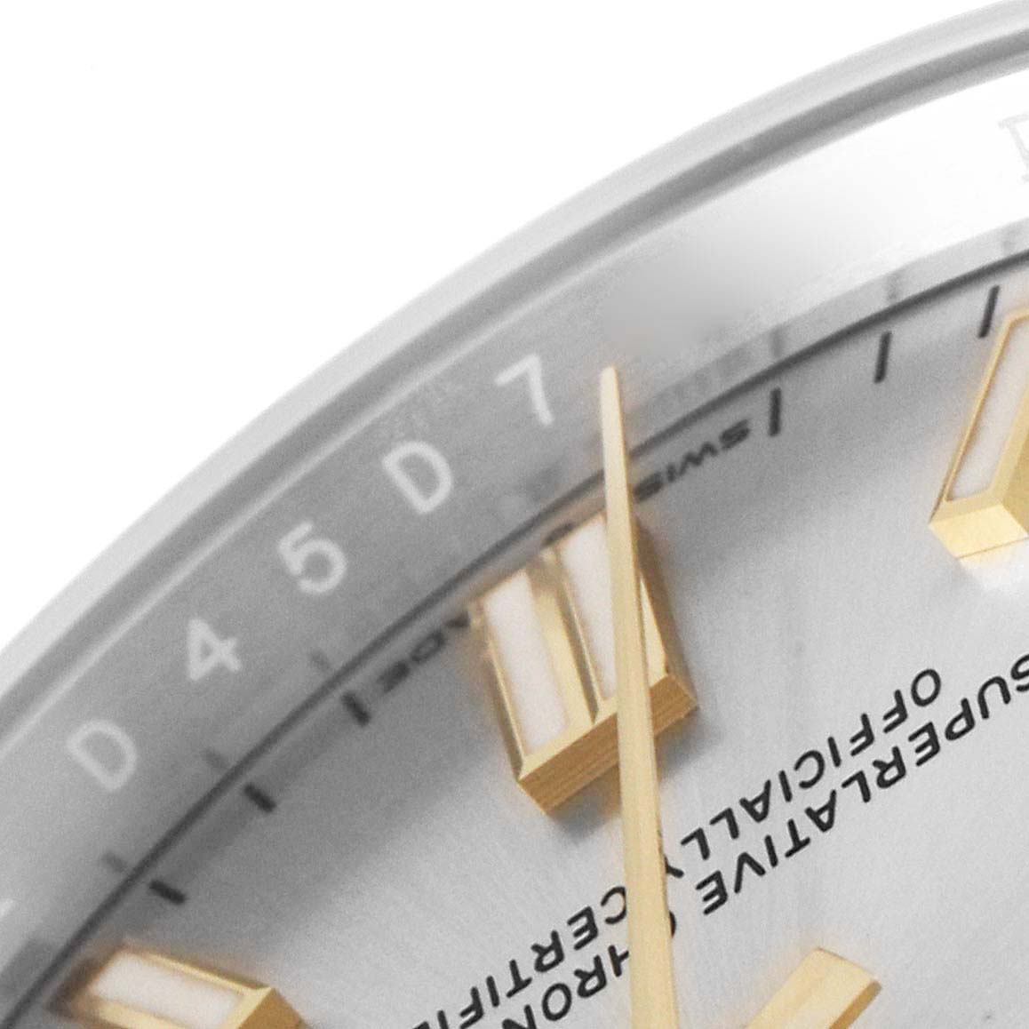 The image shows a close-up of the dial and minute hand of a Rolex Oyster Perpetual 126000 Men's Stainless Steel Silver Dial 126000 Men's Stainless Steel Silver Dial watch.
