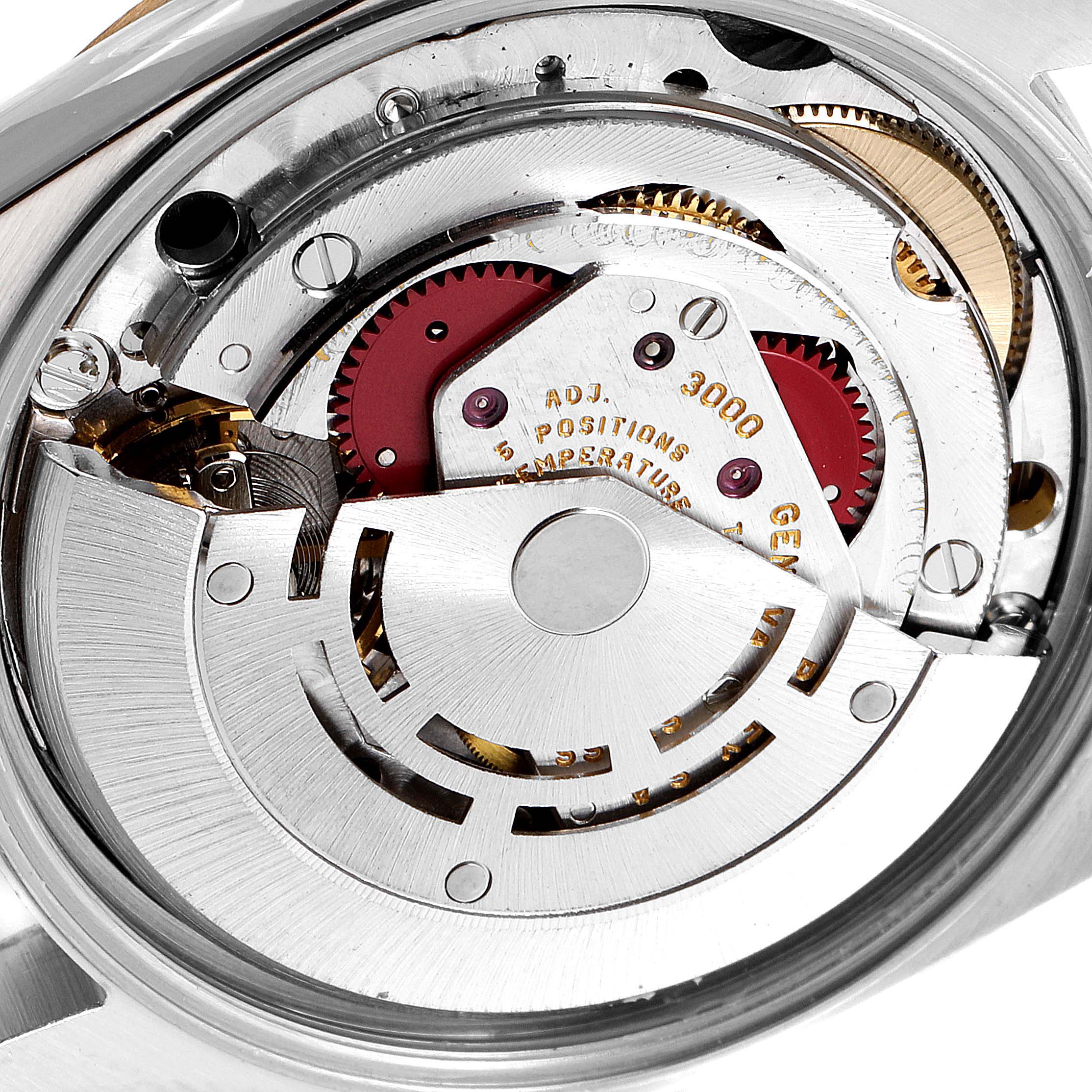 This image shows a close-up of the inner mechanical components of the Rolex Oyster Perpetual 14203 Men's Steel and Gold (two tone) White Dial 14203 Men's Steel and Gold (two tone) White Dial watch.