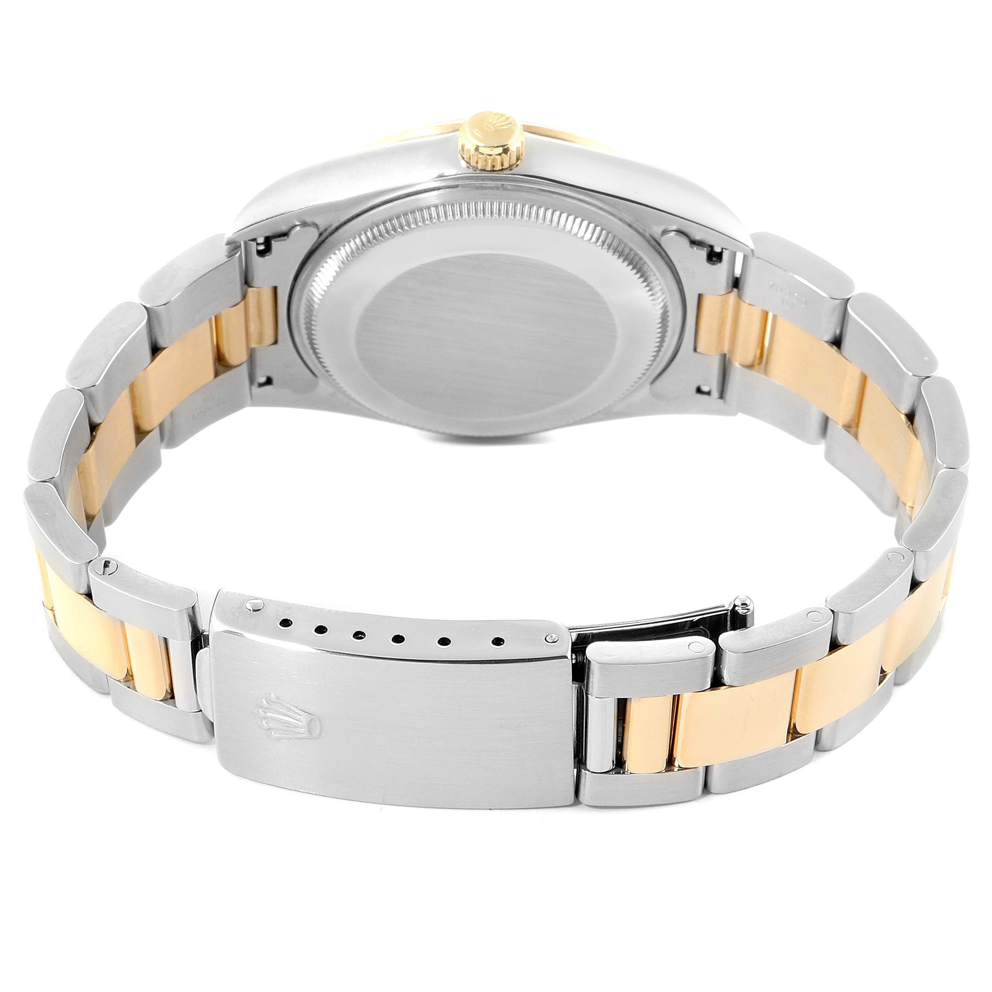 The image shows the back view of the Rolex Oyster Perpetual 14203 Men's Steel and Gold (two tone) White Dial 14203 Men's Steel and Gold (two tone) White Dial watch, including the case back, crown, and bracelet clasp.
