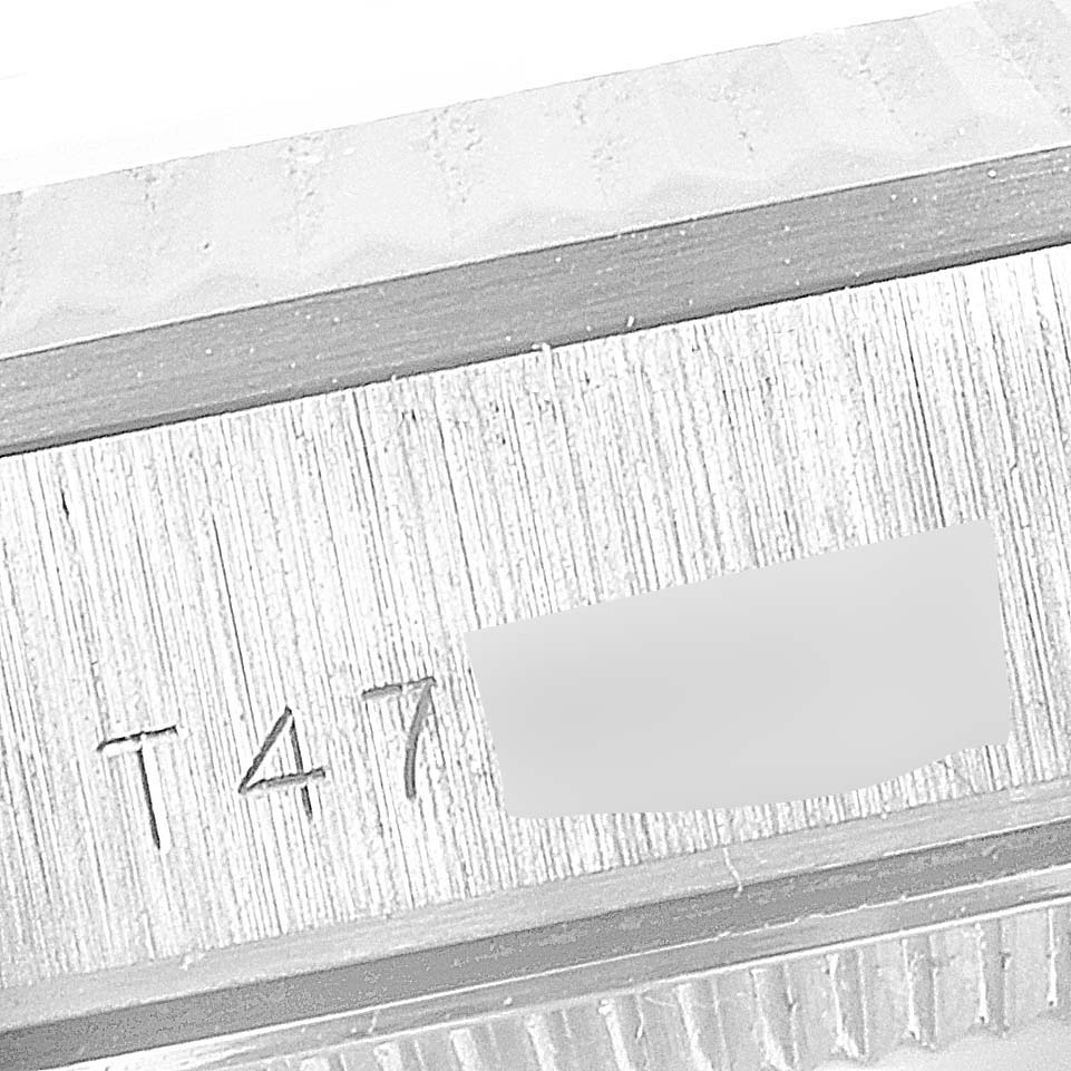 This image shows a close-up view of the side of a Rolex President 68279 Women
s White Gold Silver Dial 68279 Women
s White Gold Silver Dial model watch, focusing on the serial number engraving.