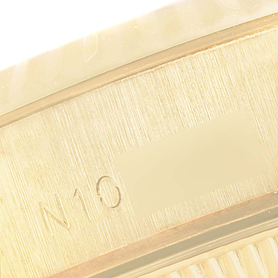 This image shows a close-up of the serial number engraved on the side of a Rolex President 69178 Women's Yellow Gold Black Dial 69178 Women's Yellow Gold Black Dial model watch.