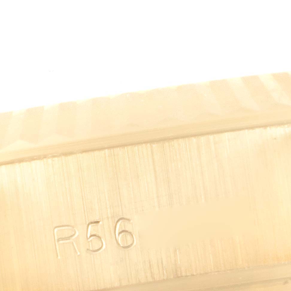 This image shows a close-up angle of the bracelet of a Rolex President 69178 Women's Yellow Gold Champagne Dial 69178 Women's Yellow Gold Champagne Dial model watch, highlighting its serial number engraving.