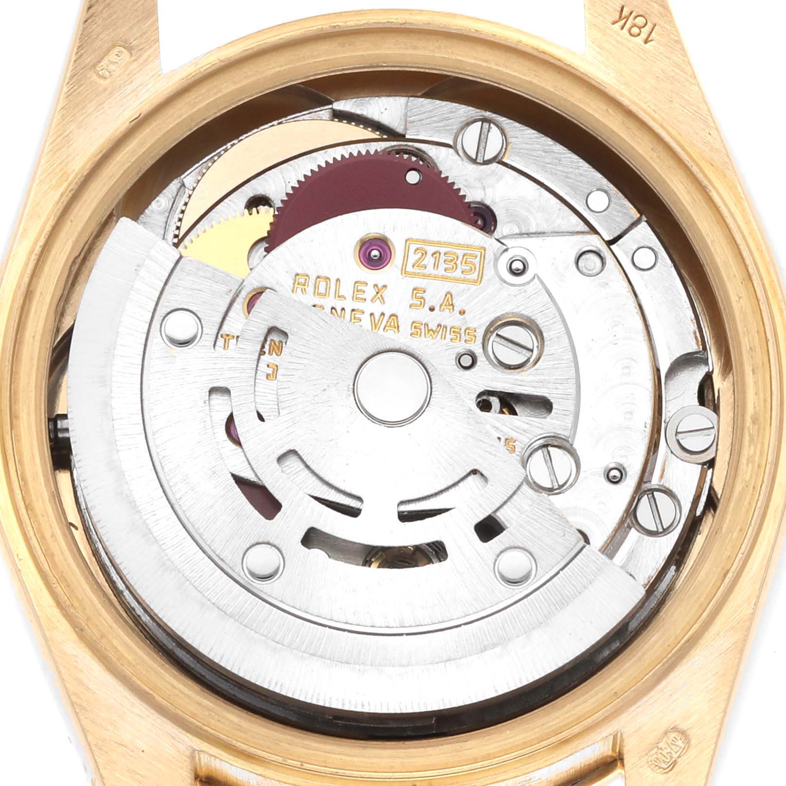 The image shows the internal movement of a Rolex President 69158 Women
s Yellow Gold Champagne Dial, viewed from the back, displaying gears and mechanical components.