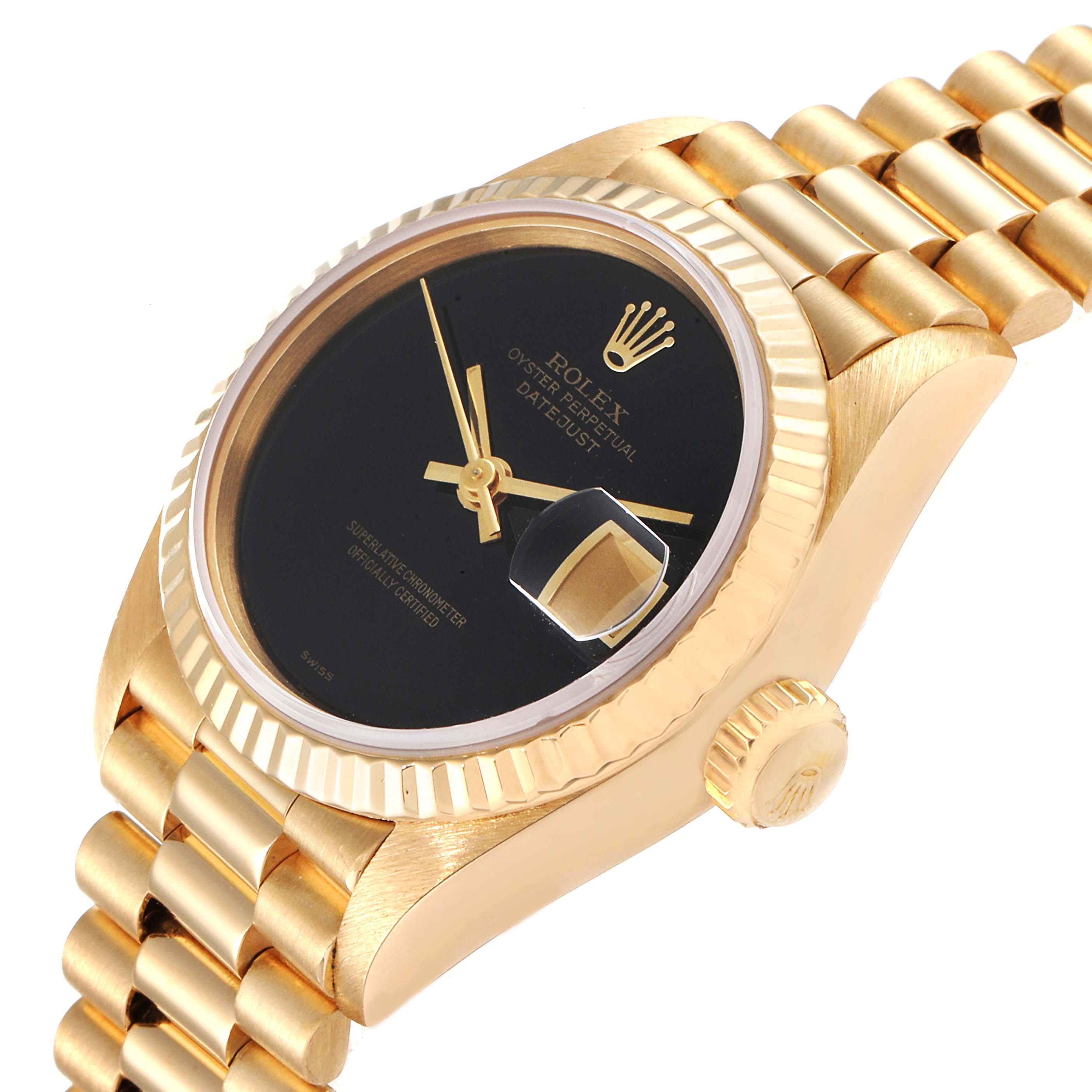 The image shows the Rolex President 69178 Women's Yellow Gold Black Dial 69178 Women's Yellow Gold Black Dial model watch at an oblique angle highlighting its black dial, gold fluted bezel, and gold bracelet.