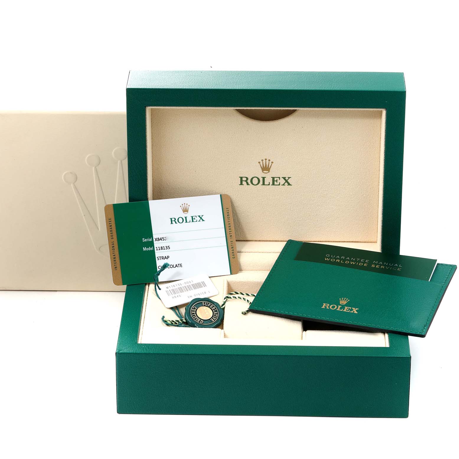 The image shows the packaging and accessories for a Rolex President 118135 Men's Rose Gold Brown Dial 118135 Men's Rose Gold Brown Dial model, including a box, tag, guarantee manual, and card.