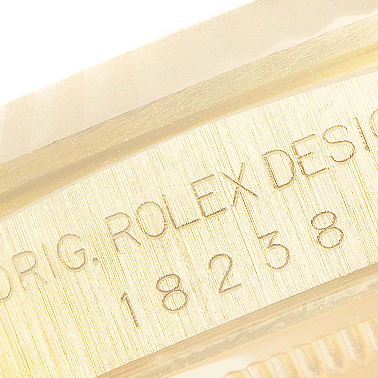 This close-up image shows the engraved model number on a Rolex President 18238 Men
s Yellow Gold Champagne Dial 18238 Men
s Yellow Gold Champagne Dial watch.