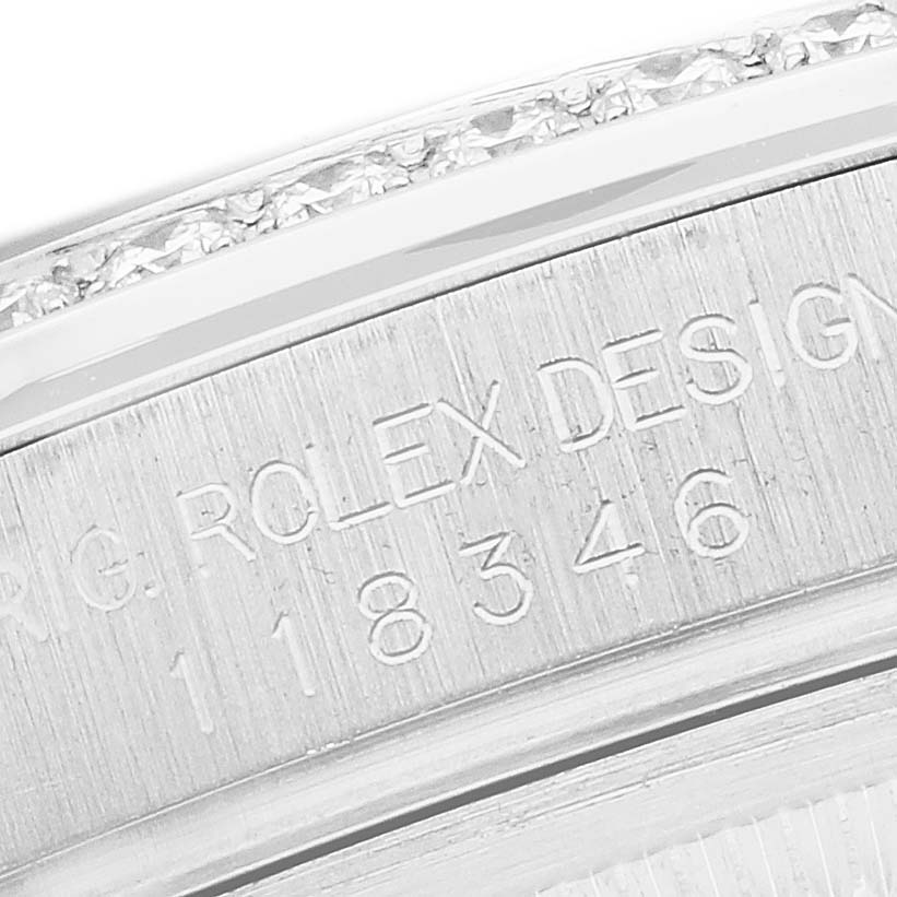 The image shows an engraved side view of a Rolex President 118346 Men
s Platinum Silver Dial watch with part of the case and serial numbers visible.