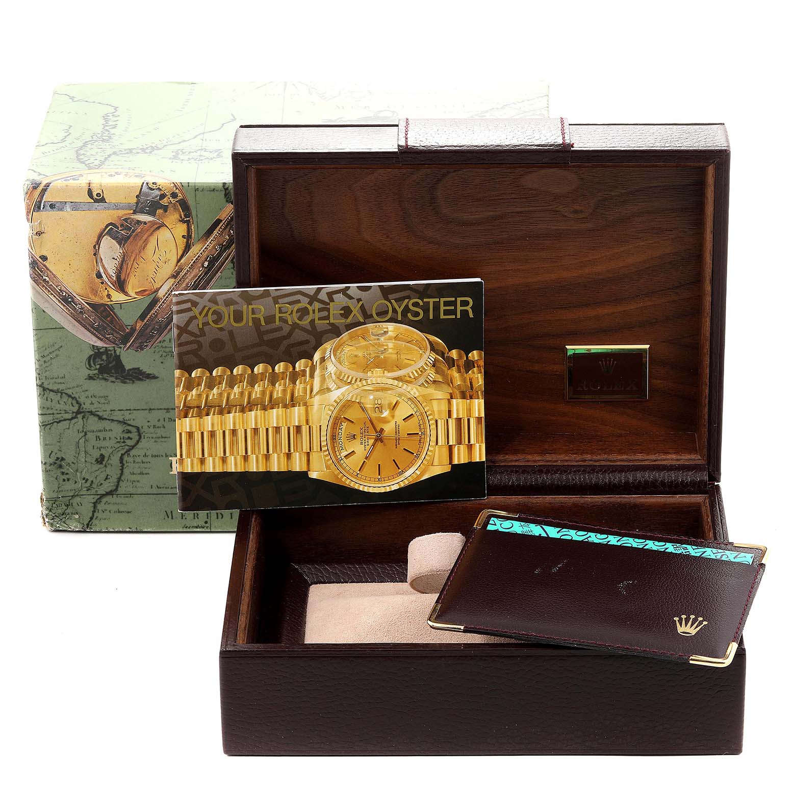 This image shows the packaging, a warranty card, and a booklet for the Rolex President 18238 Men's Yellow Gold Champagne Dial 18238 Men's Yellow Gold Champagne Dial model watch.