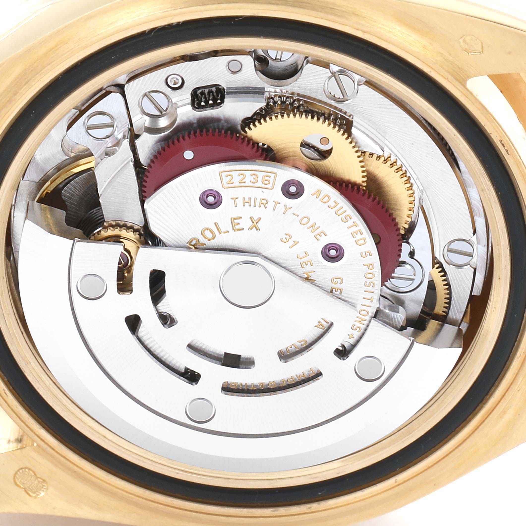 This image shows the intricate inner mechanism of a Rolex President 279138 Women's Yellow Gold Silver Dial 279138 Women's Yellow Gold Silver Dial model watch from a close-up angle.