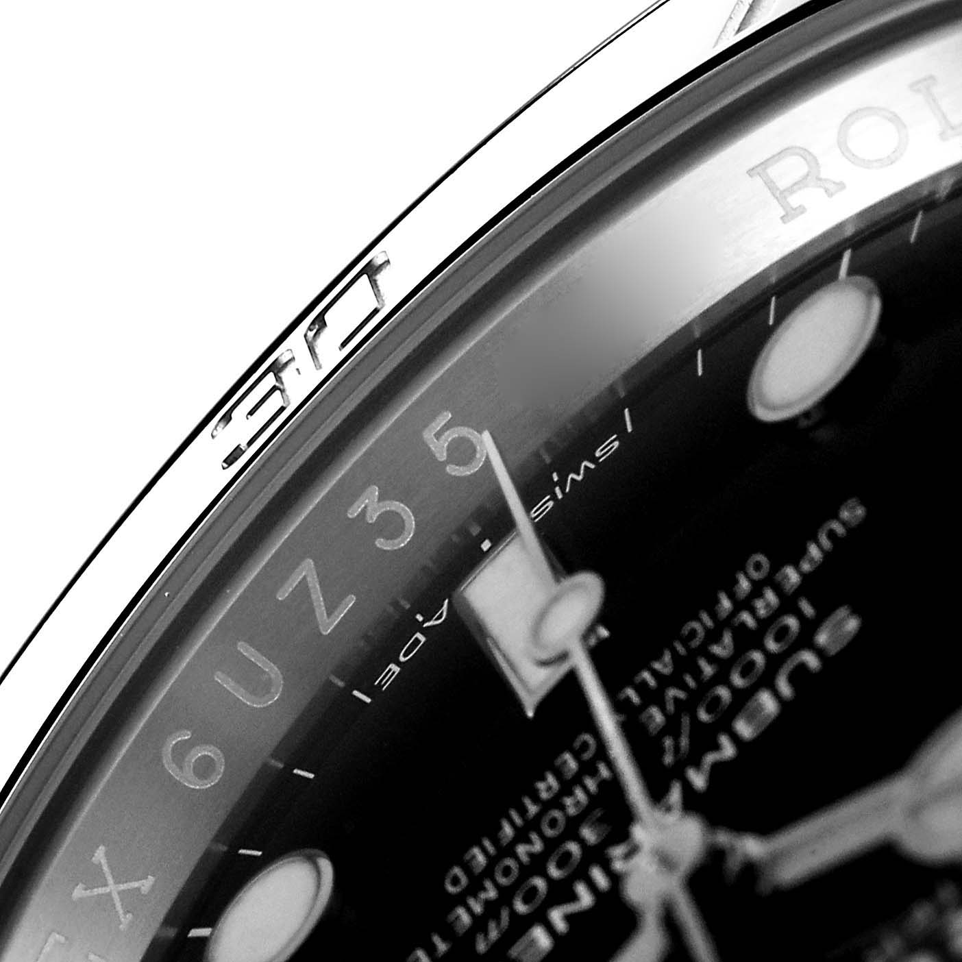 The image shows a close-up of the dial and part of the bezel of a Rolex Submariner 114060 Men
s Stainless Steel Black Dial 114060 Men
s Stainless Steel Black Dial watch, with focus on the details and markings.