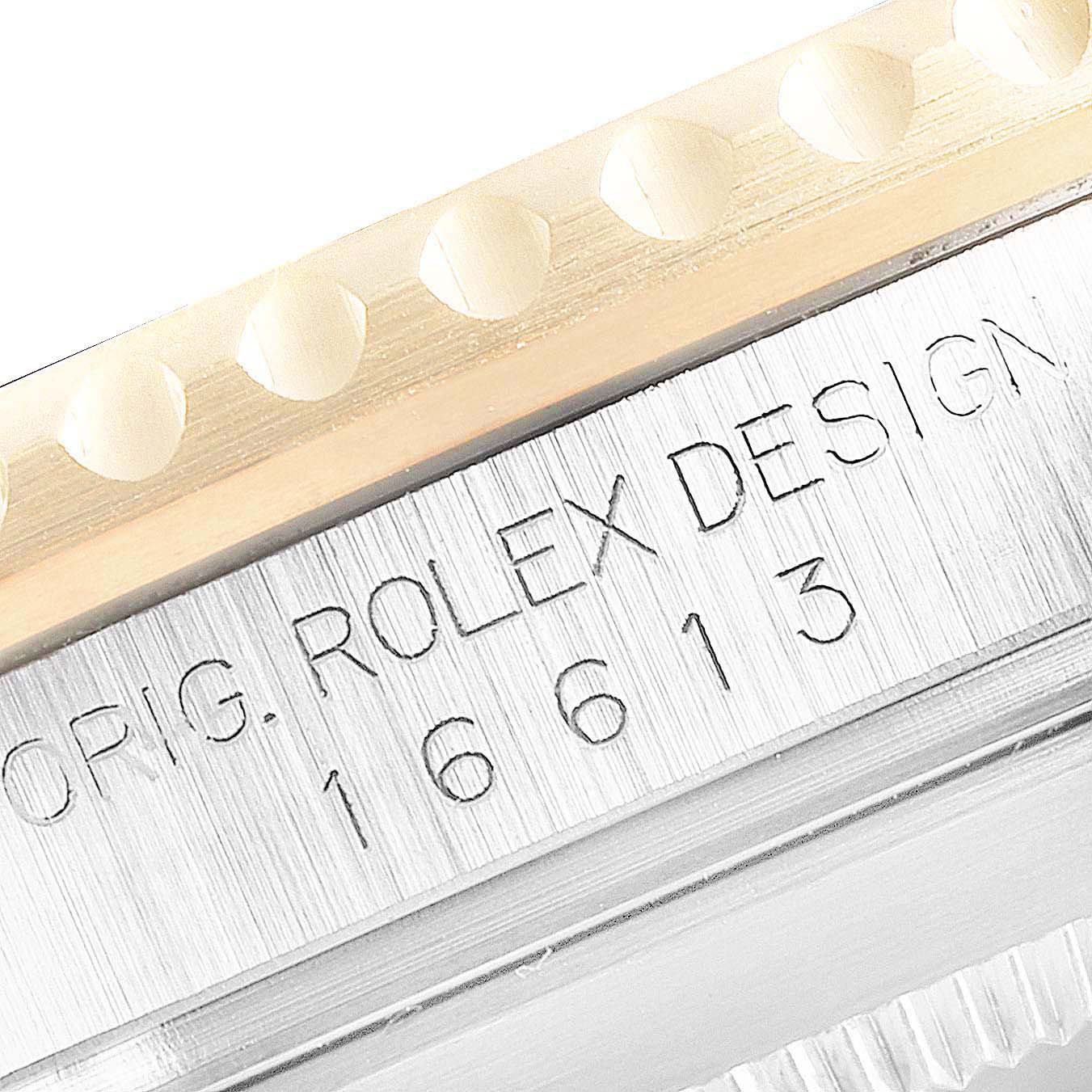 This image shows a close-up of the bezel and case side of a Rolex Submariner 16613 Men's Steel and Gold (two tone) Blue Dial 16613 Men's Steel and Gold (two tone) Blue Dial, featuring the model number 16613.