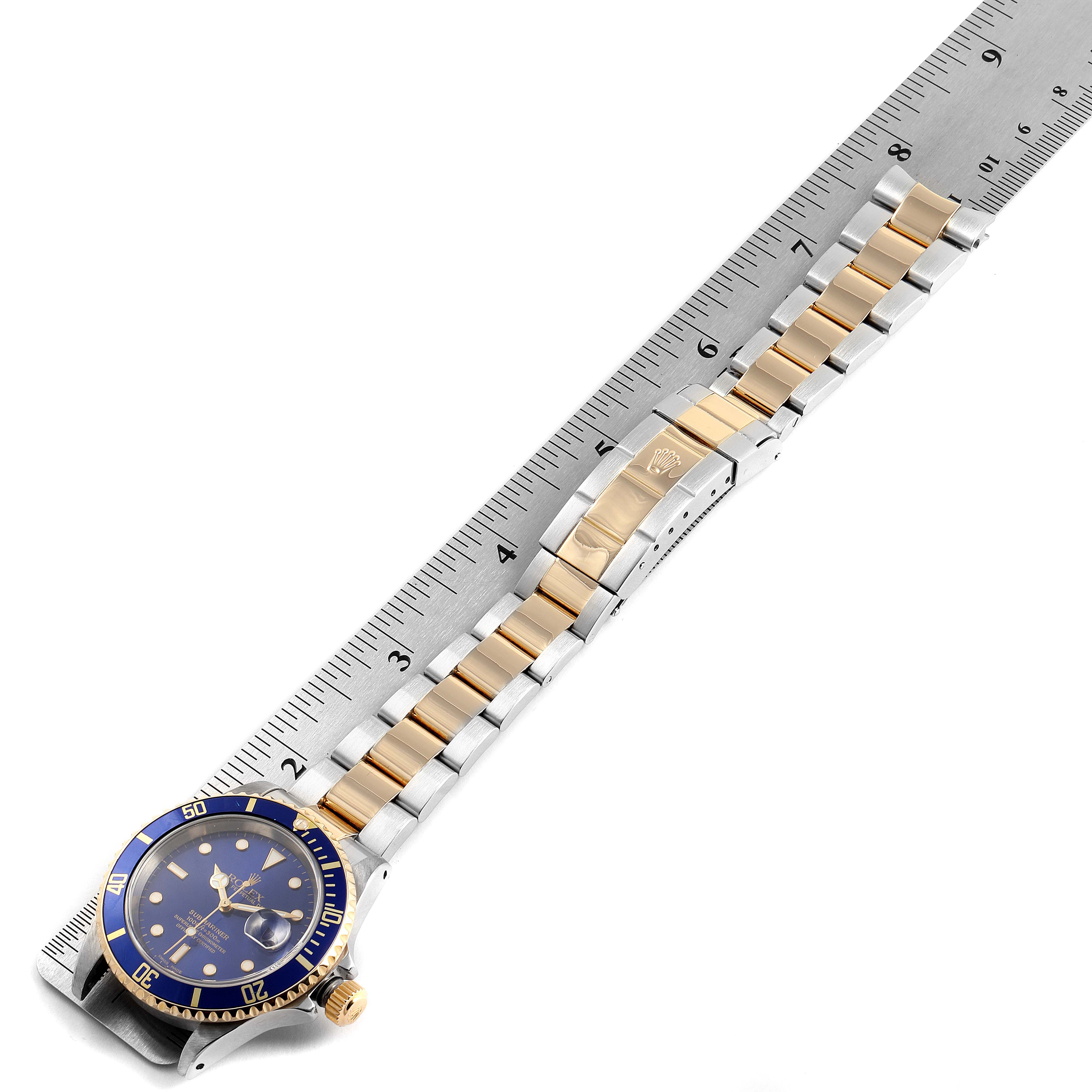 The Rolex Submariner 16613 Men's Steel and Gold (two tone) Blue Dial 16613 Men's Steel and Gold (two tone) Blue Dial watch is shown at a top-down angle, displaying the dial, bezel, and full bracelet.