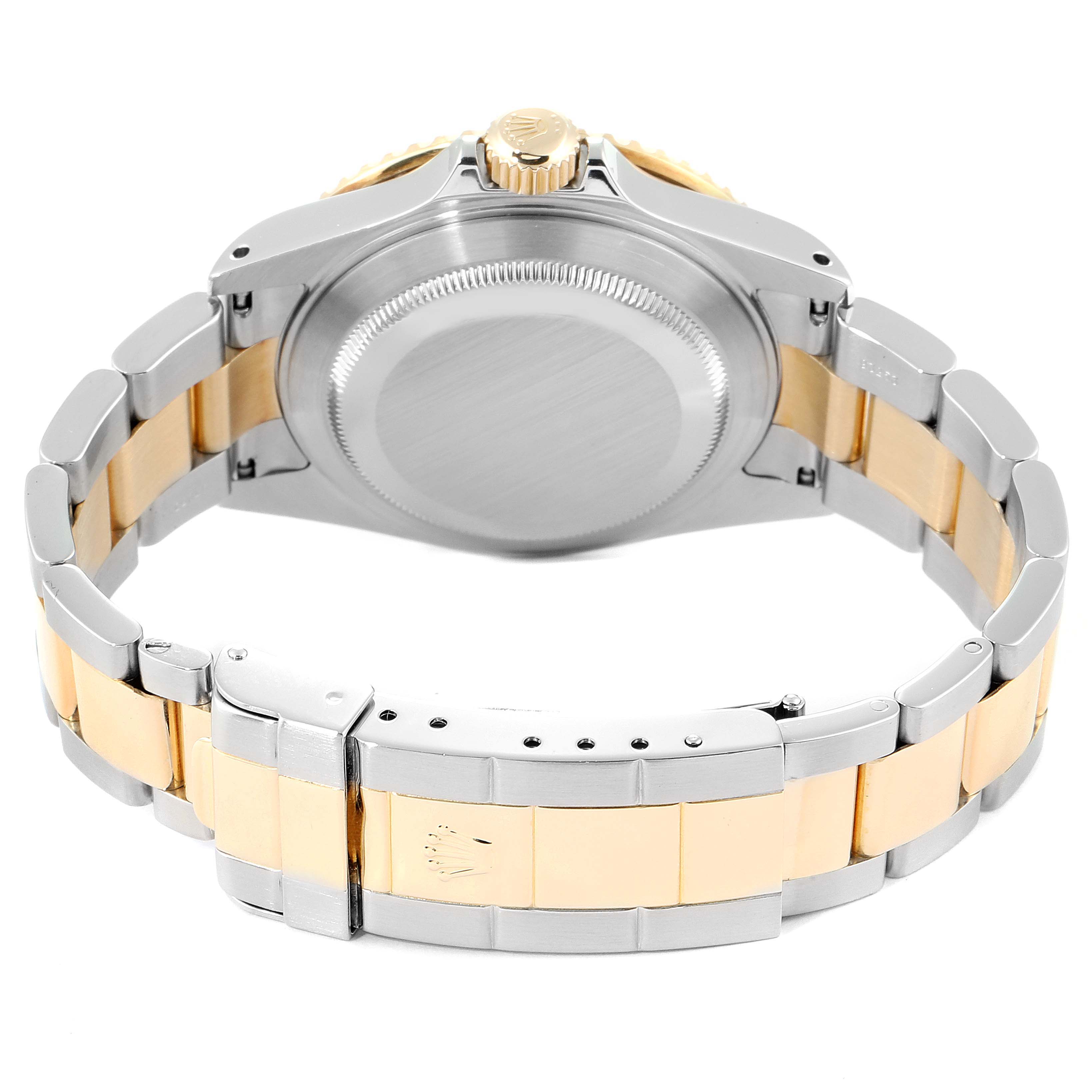 The image shows the Rolex Submariner 16613 Men's Steel and Gold (two tone) Blue Dial 16613 Men's Steel and Gold (two tone) Blue Dial watch from the back angle, highlighting the bracelet, clasp, case back, and crown.