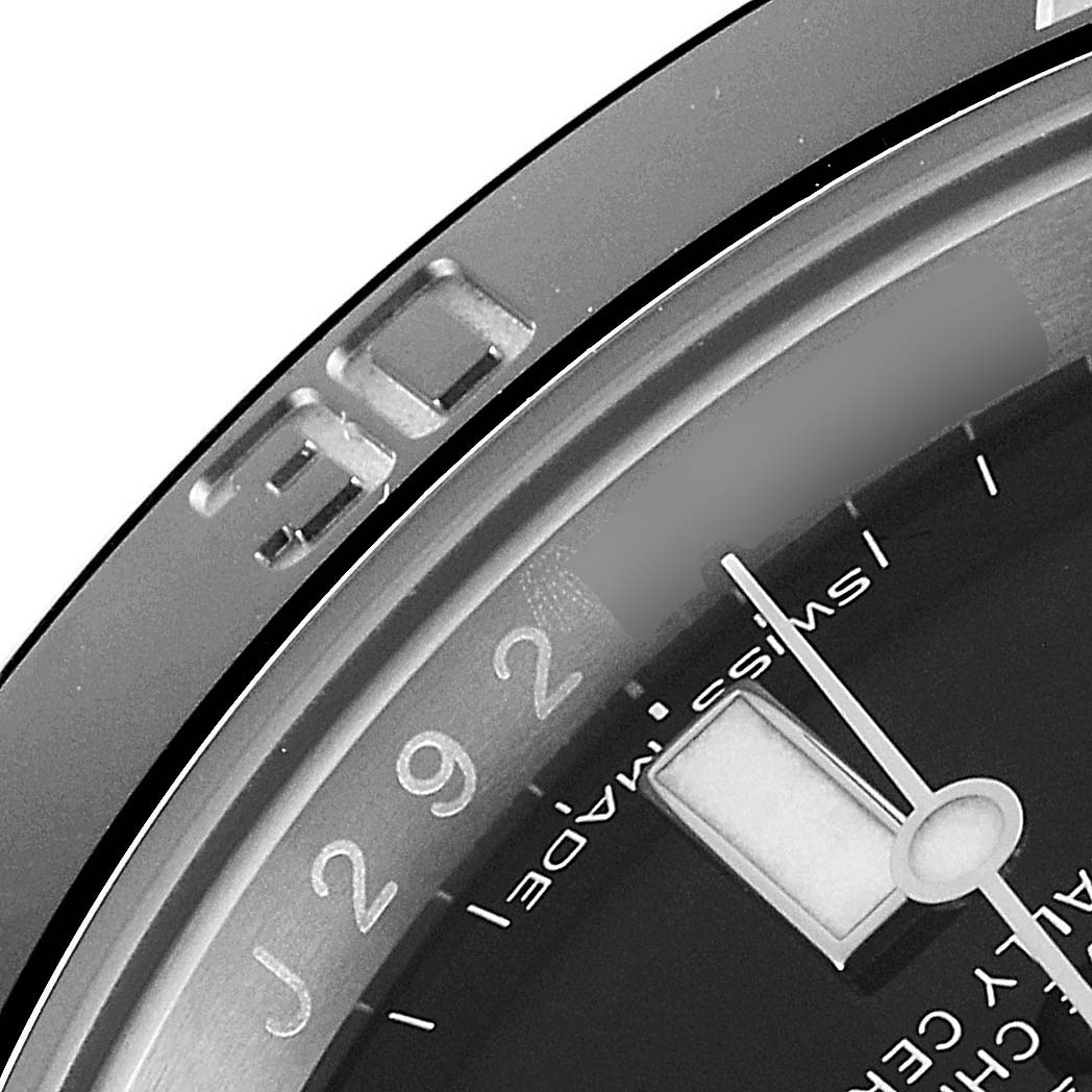This image shows an angled close-up of the bezel and dial of a Rolex Submariner 116610LN Men's Stainless Steel Black Dial 116610LN Men's Stainless Steel Black Dial watch, highlighting the 10-minute mark.